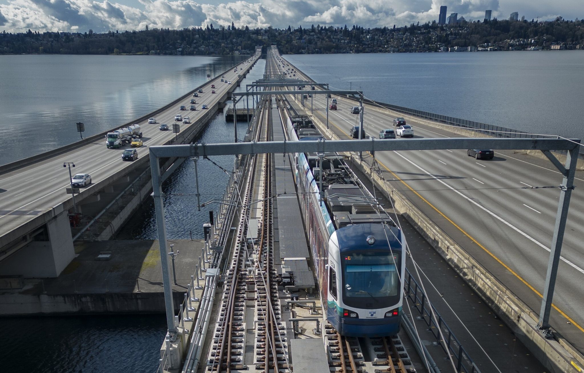 A light-rail train crosses the I-90 floating bridge during testing earlier this month. (Ellen M. Banner / The Seattle Times)