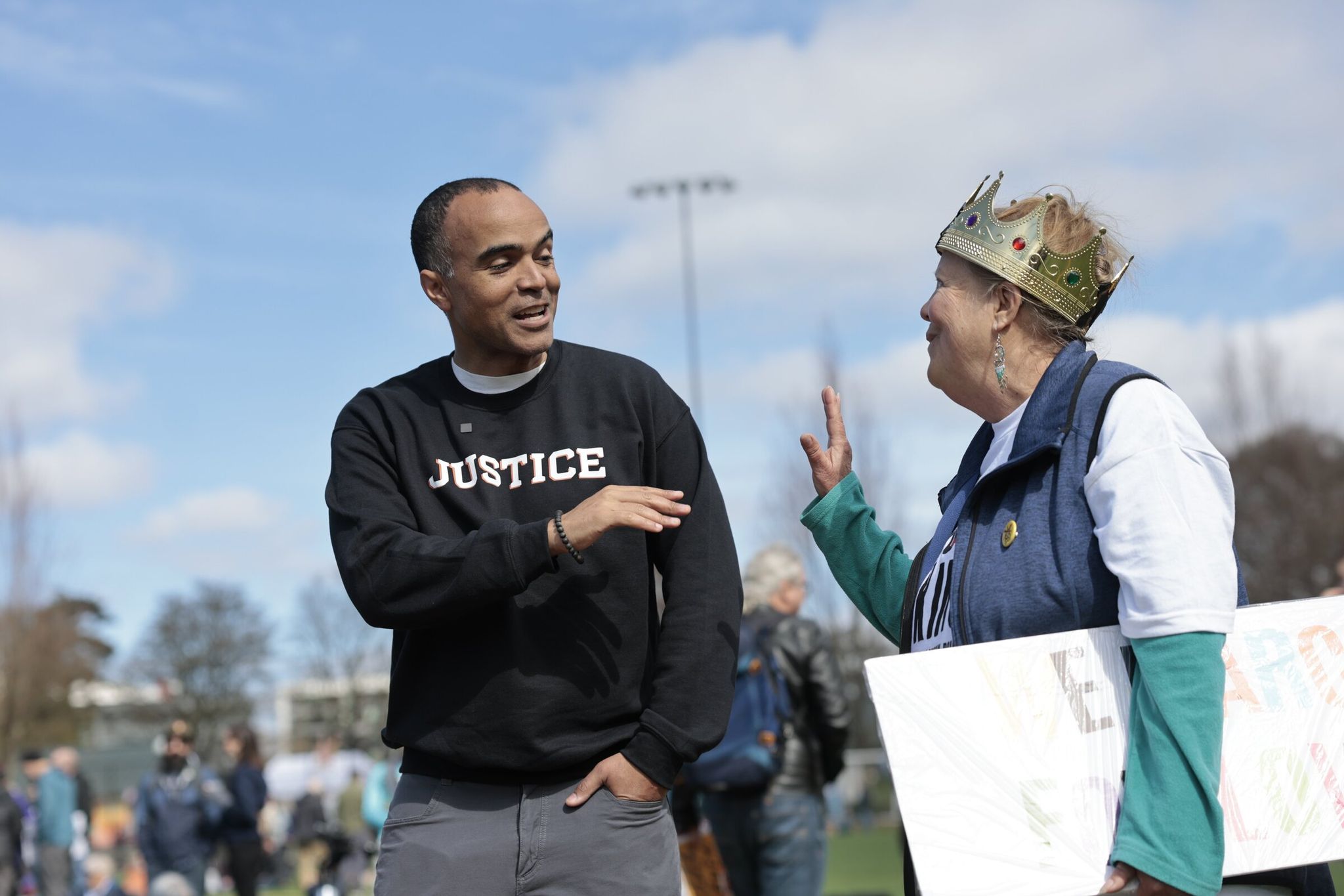 Washington Attorney General Nick Brown talks with Susan Godfrey of Seattle at the start of the No Kings rally and march, which began at Cal Anderson Park and headed toward Seattle Center on Saturday. (Karen Ducey / The Seattle Times)