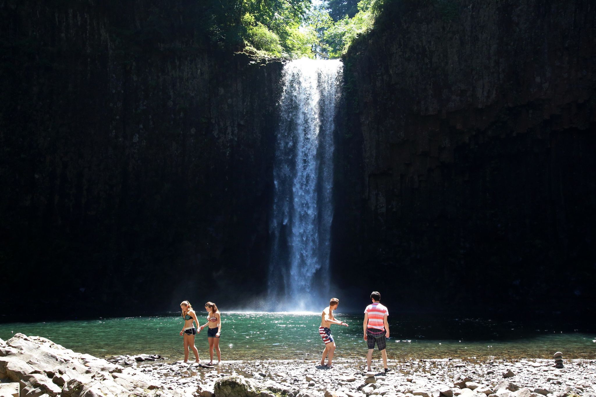 A group of friends gathers at Abiqua Falls on a warm spring day. (Jamie Hale | The Oregonian/oregonlive.com/TNS)