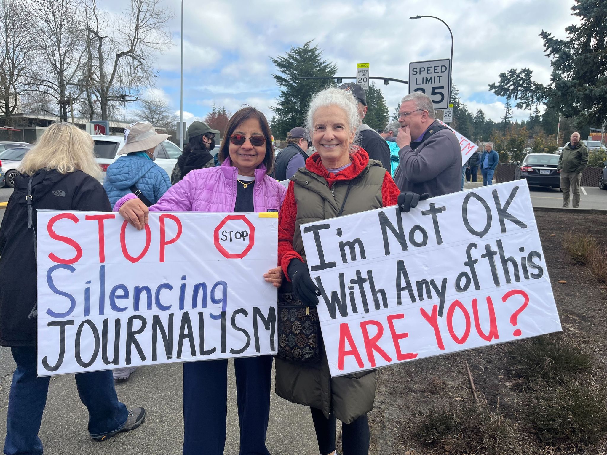 Rama Shivashankara (left) and Diane Hamlin at the No Kings protest in Bellevue on Saturday morning. (Stephannie Stokes / The Seattle Times)