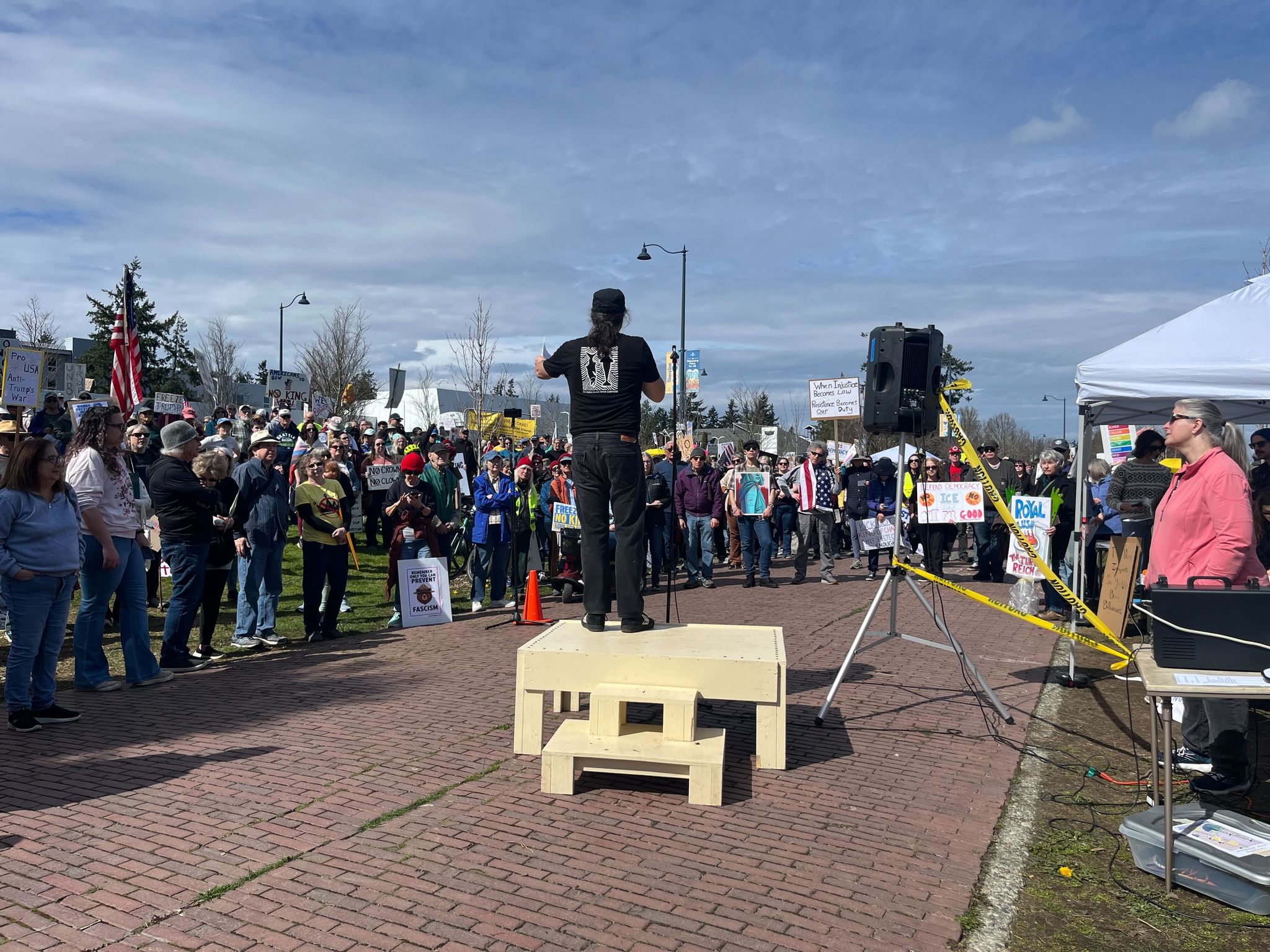 Protesters take part in the Shoreline No Kings rally on Saturday.