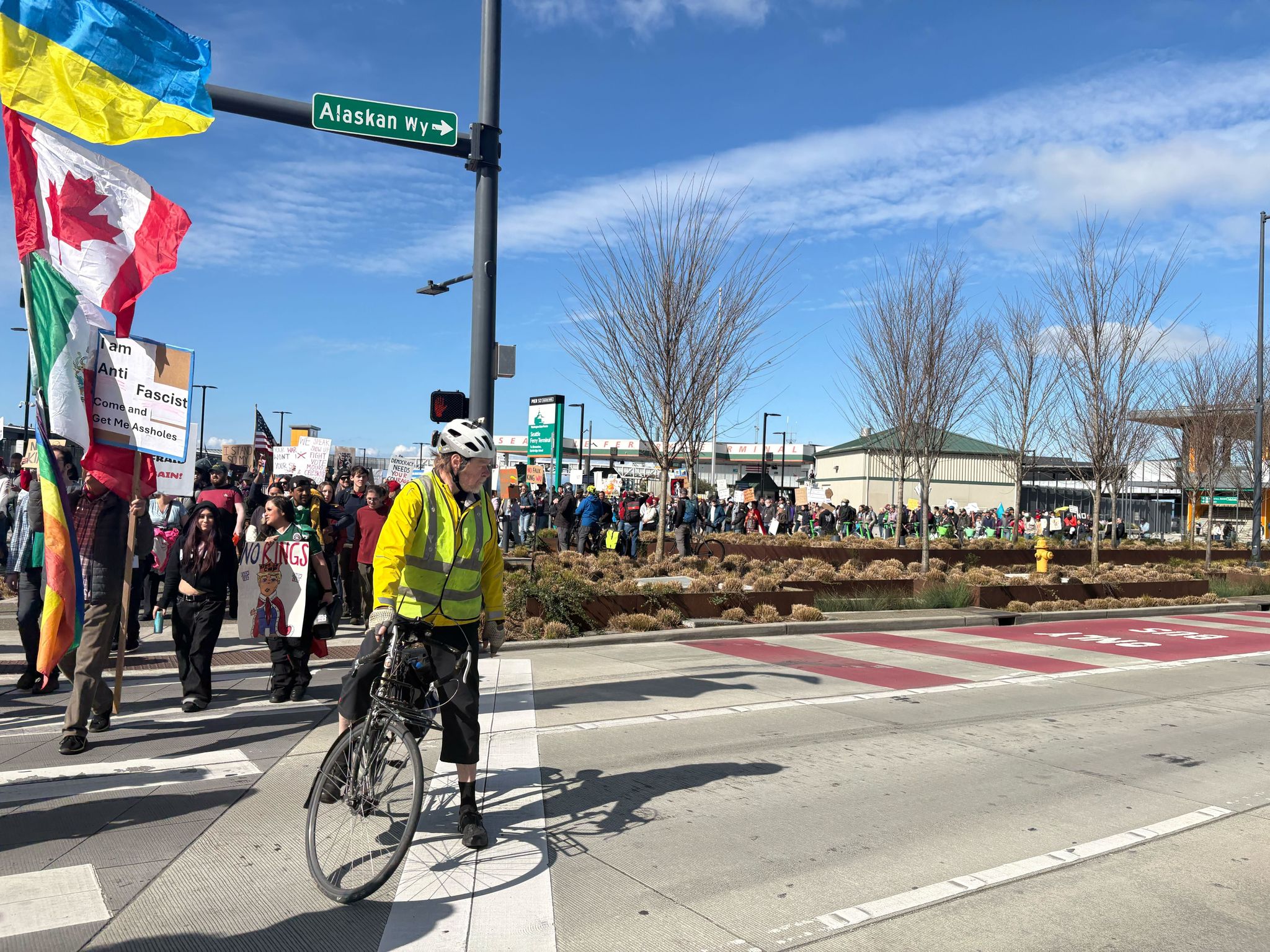 No Kings protesters began moving from Coleman Dock to Cal Anderson Park on Saturday. (Caitlyn Freeman / The Seattle Times)