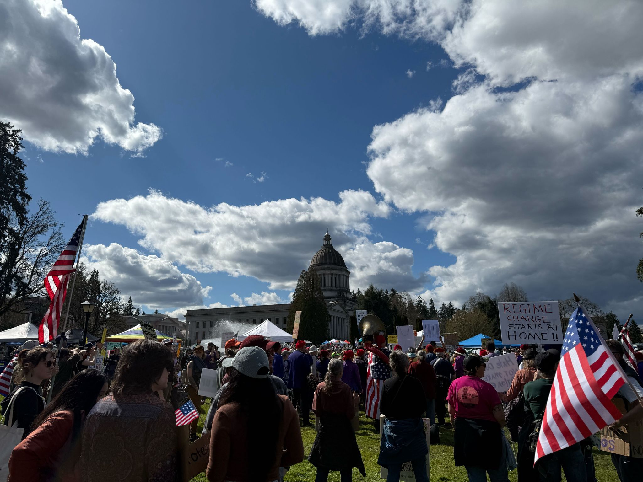 On Saturday, waving signs and singing, thousands gathered at the 'No Kings' protest in Olympia on the Capitol grounds.