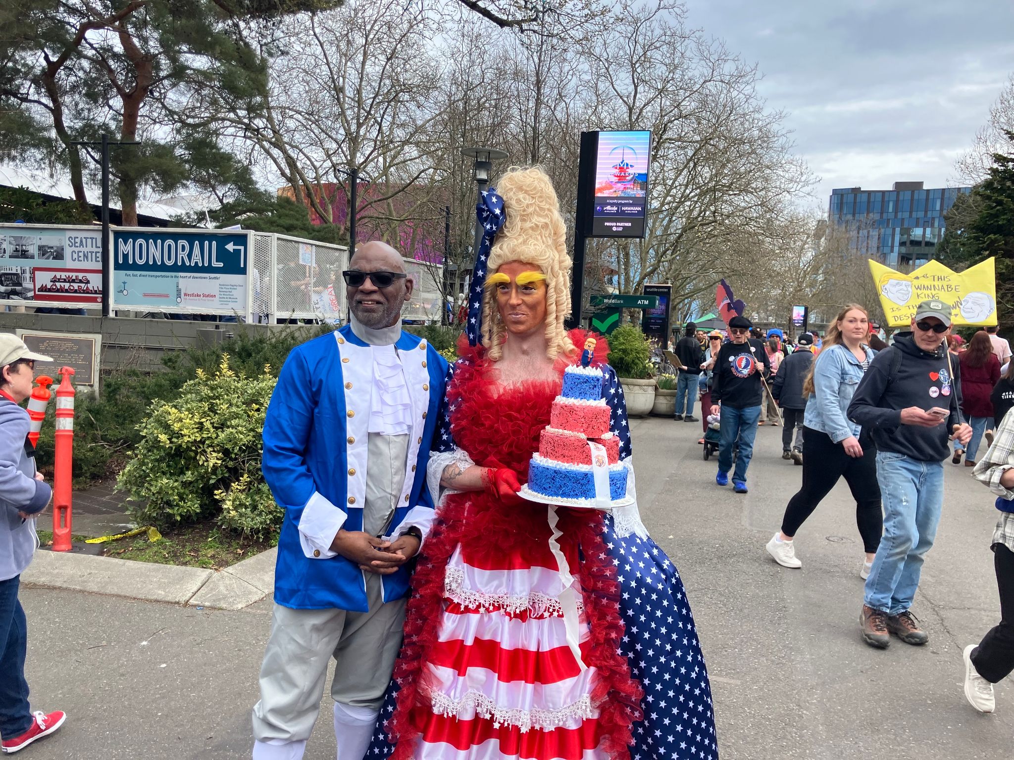 David Payne, dressed as one of the Founding Fathers, left, and Patrick Whitaker, dressed as Marie Antoinette, at Seattle Center. (Nina Shapiro / The Seattle Times)