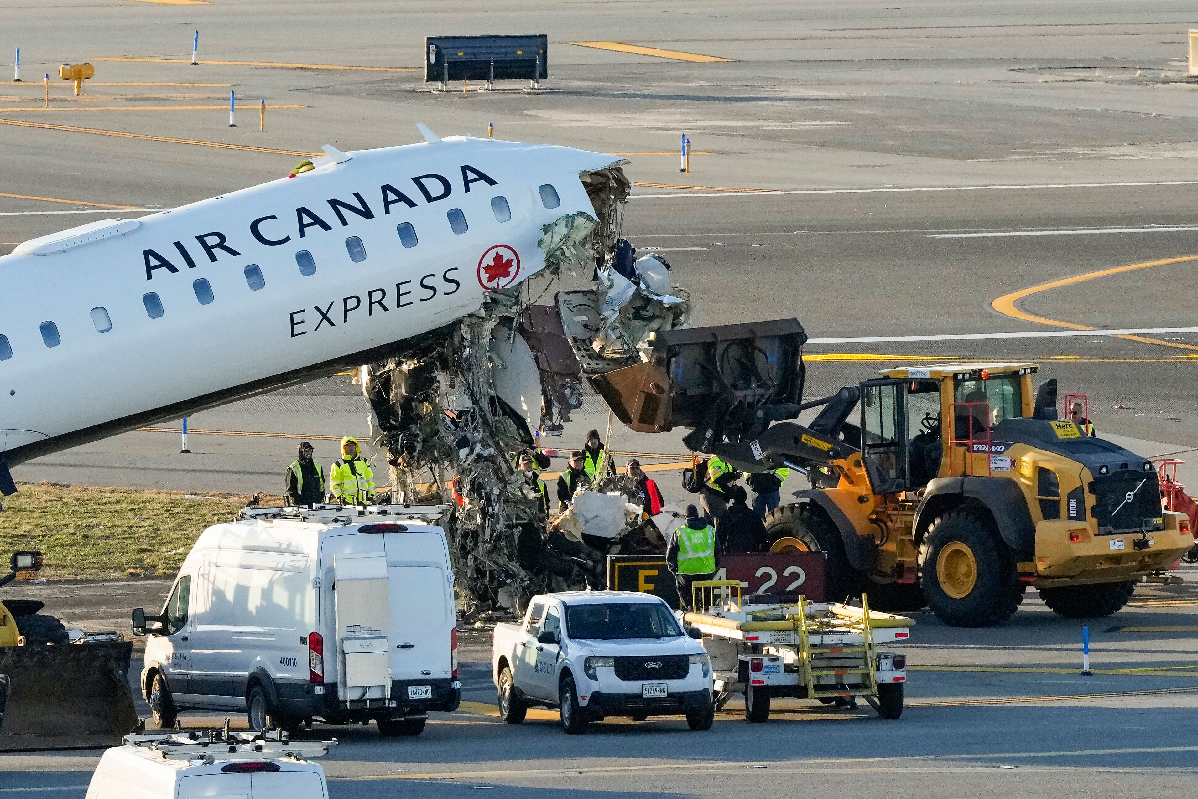 Photos show the scene of a collision on a runway at LaGuardia
