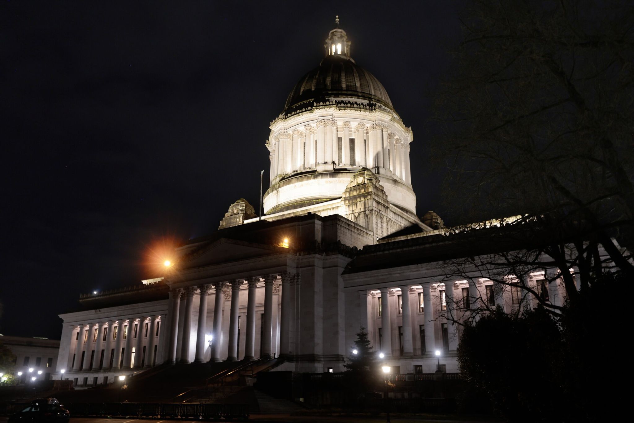 The Legislature building lit at night, seen on the Capitol grounds in Olympia on Tuesday, March 10, 2026. (Karen Ducey / The Seattle Times)
