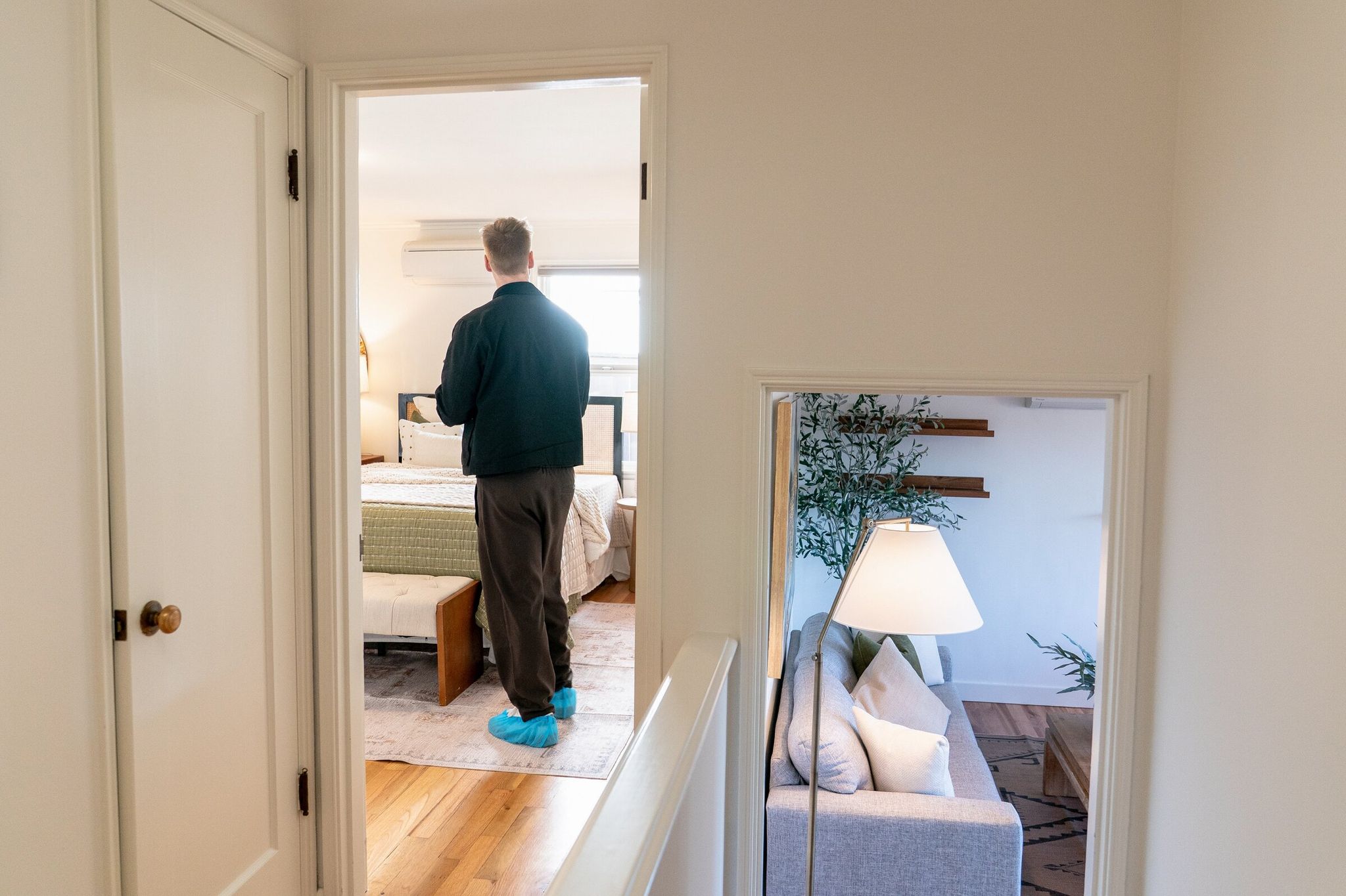 A real estate agent inspects a home in Seattle during an open house in January. Rising mortgage rates and economic uncertainty from the war with Iran are spoiling what is usually a strong season for the housing market. (David Ryder / Bloomberg)