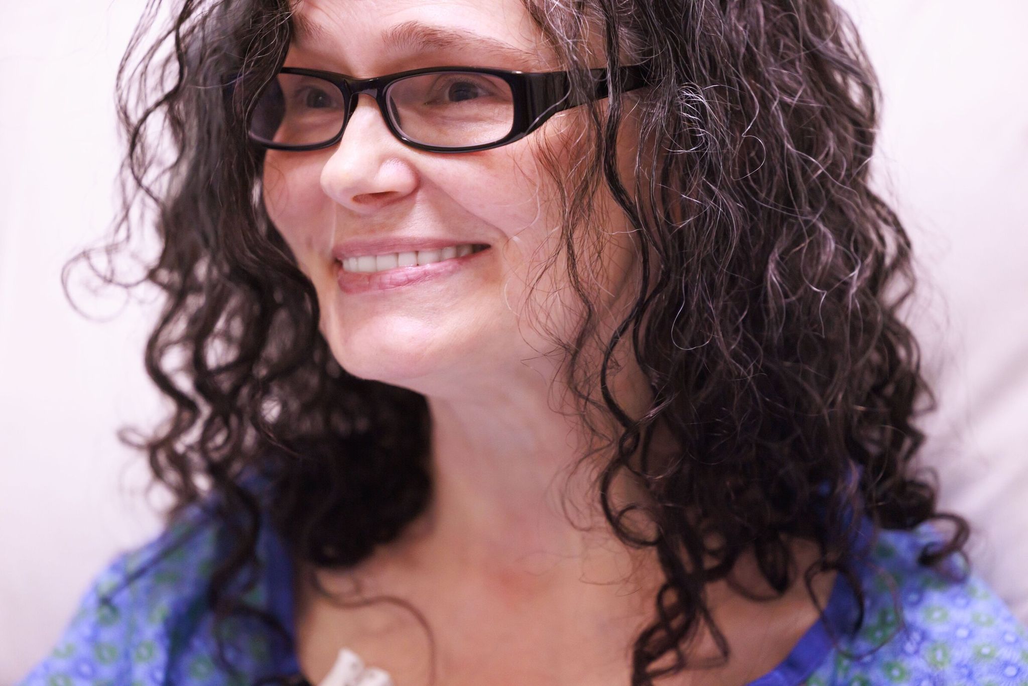 Erika Clancy, 51, prepares for thumb surgery. The former teacher has had six ligament-repair surgeries in her hands, wore a splint on and off for years, and regularly received cortisone injections to ease pain. (Erika Schultz / The Seattle Times)