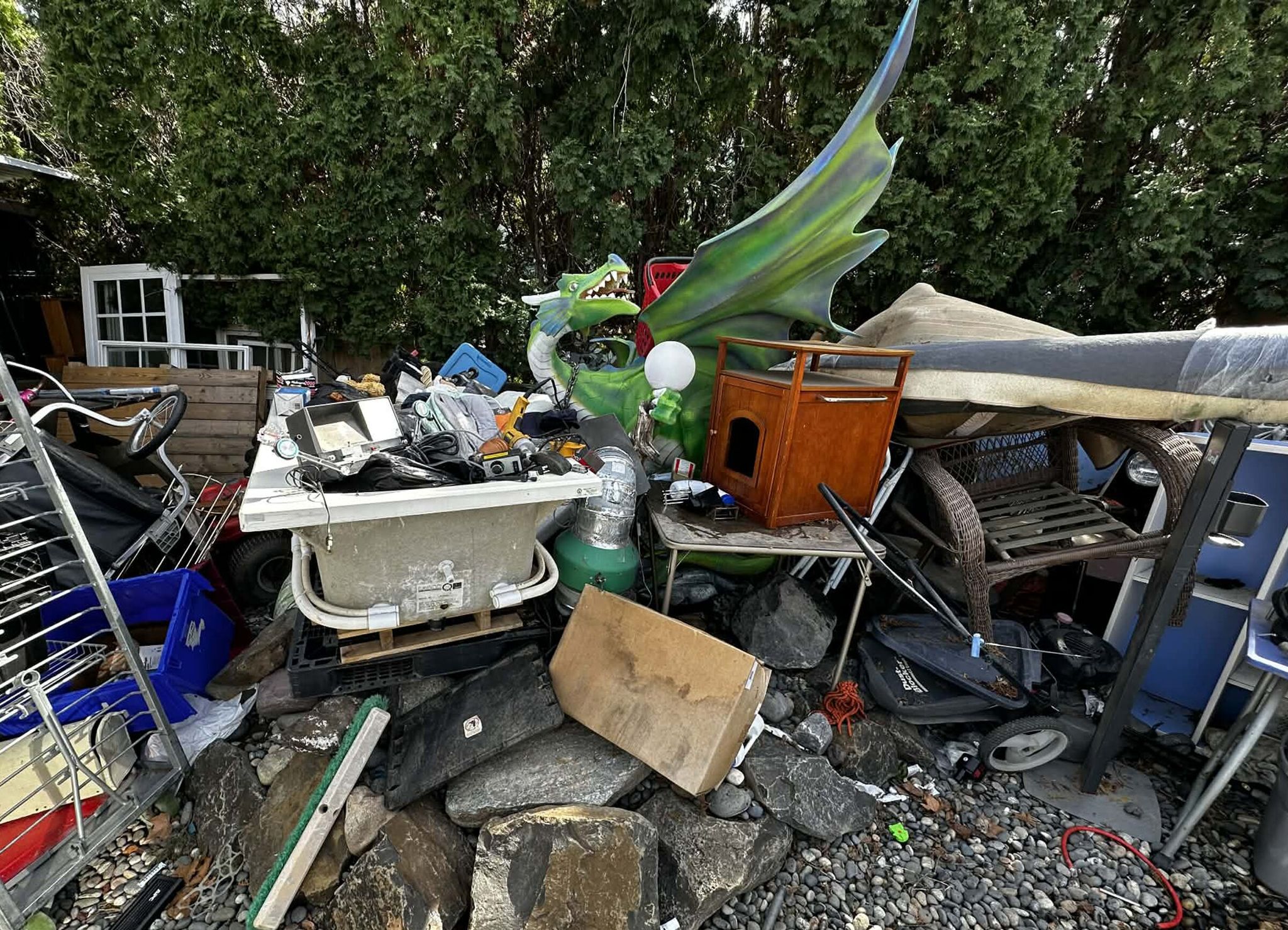 The dragon statue that went missing from Richland was found amid a pile of junk in the yard of a Haines Avenue property. (Photo: Colin Hooper)