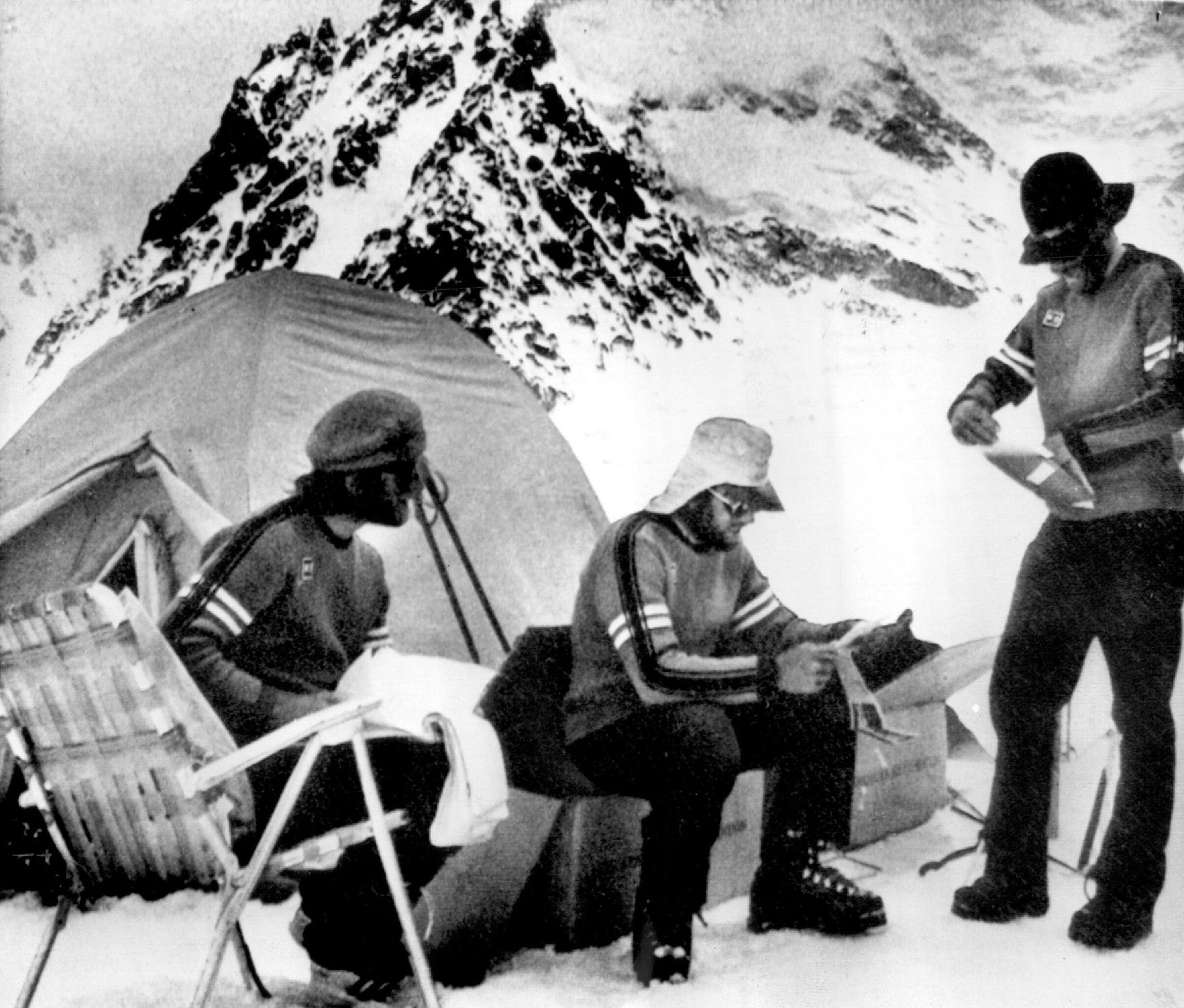 Several members of a 10-person expedition led by Seattle’s Jim Whittaker discuss plans at their base camp at 19,000 feet on K2, the world’s second-highest mountain, near Islamabad, Pakistan. Photo taken July 7, 1975, in Islamabad. (Associated Press)