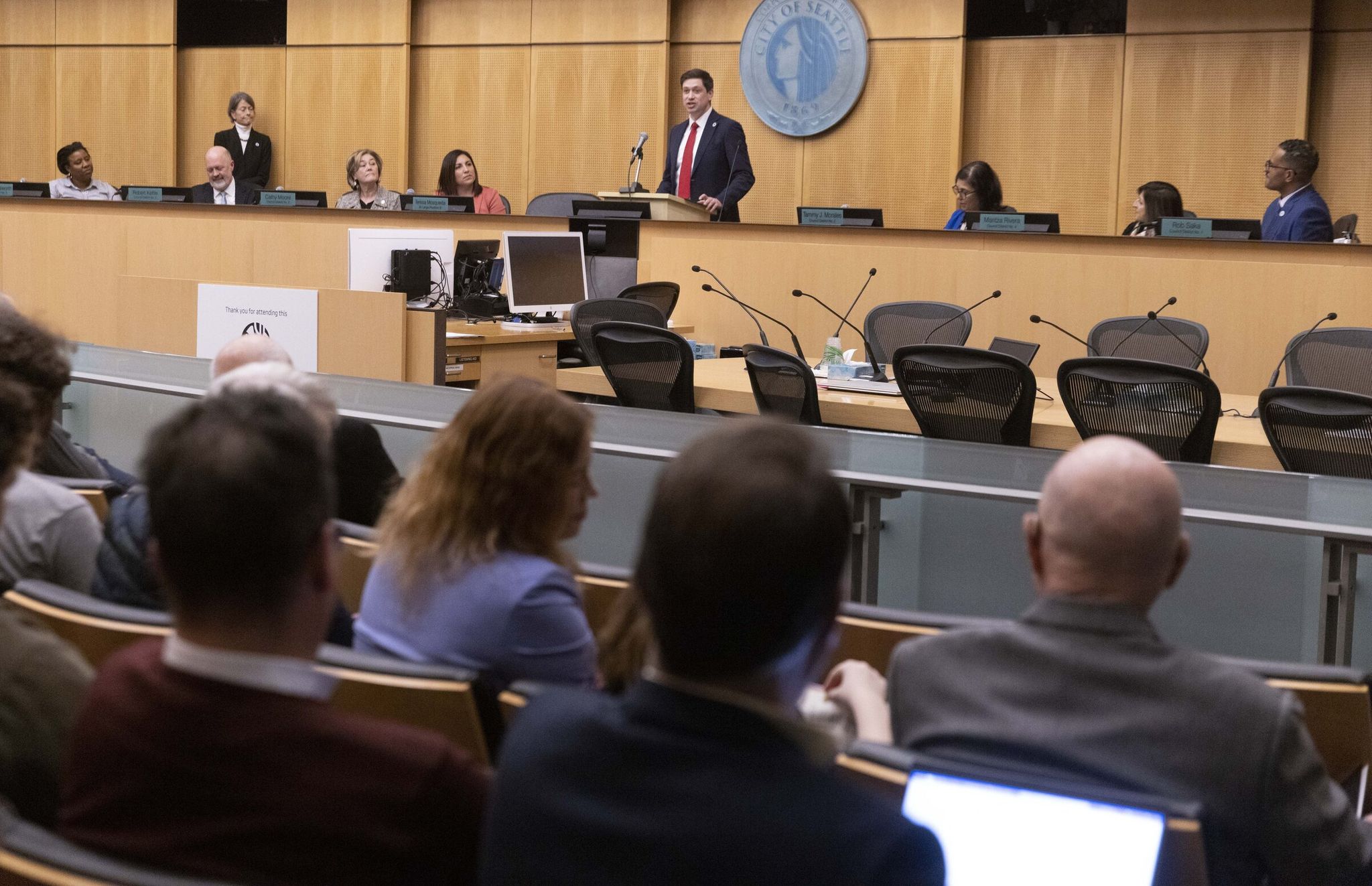 Seattle City Council member Dan Strauss speaks after taking the oath at a council meeting in 2024. (Ellen M. Banner / The Seattle Times)