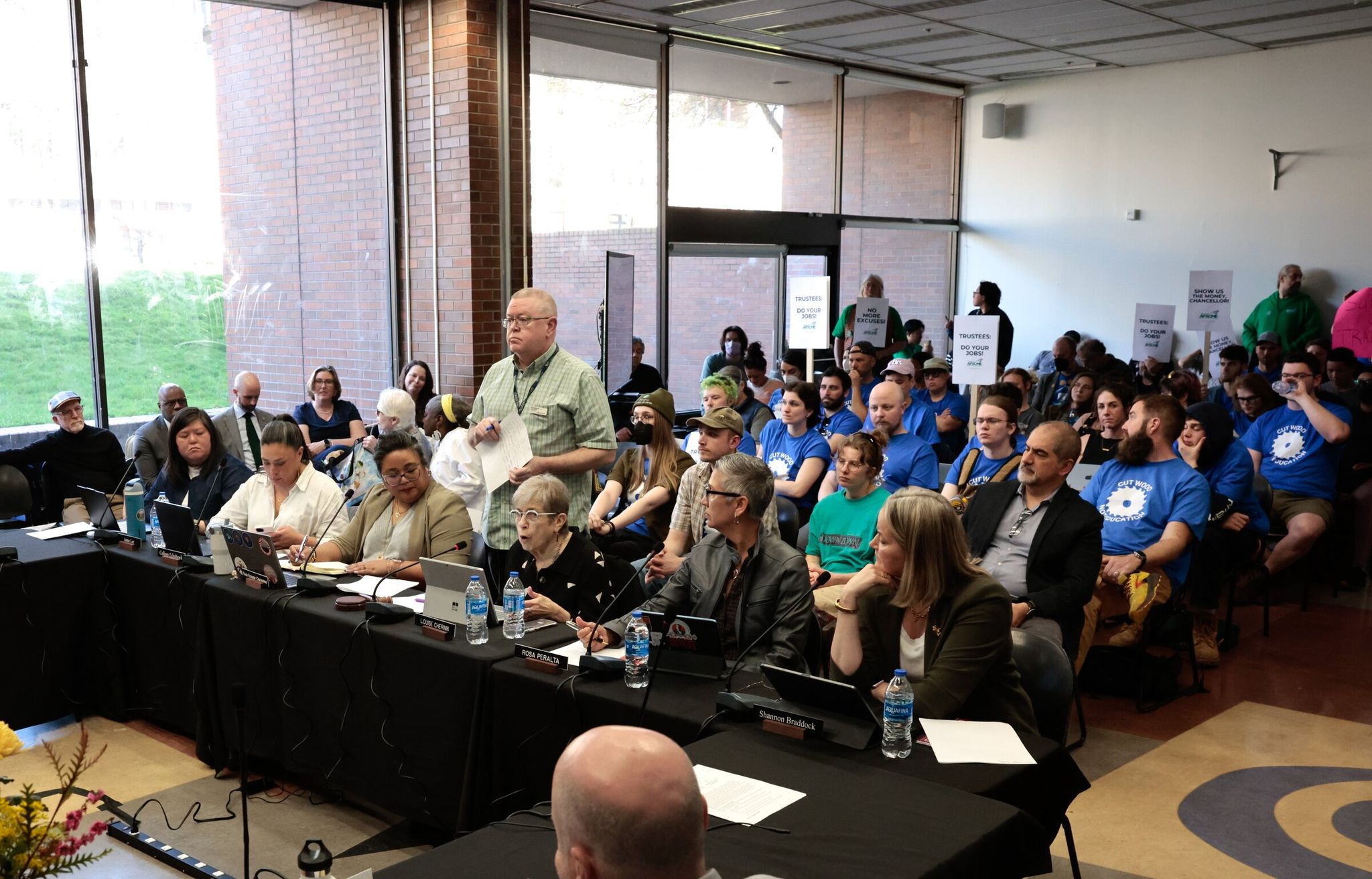 Students and others attend the Seattle Colleges board of trustees meeting on Thursday. (Karen Ducey / The Seattle Times)