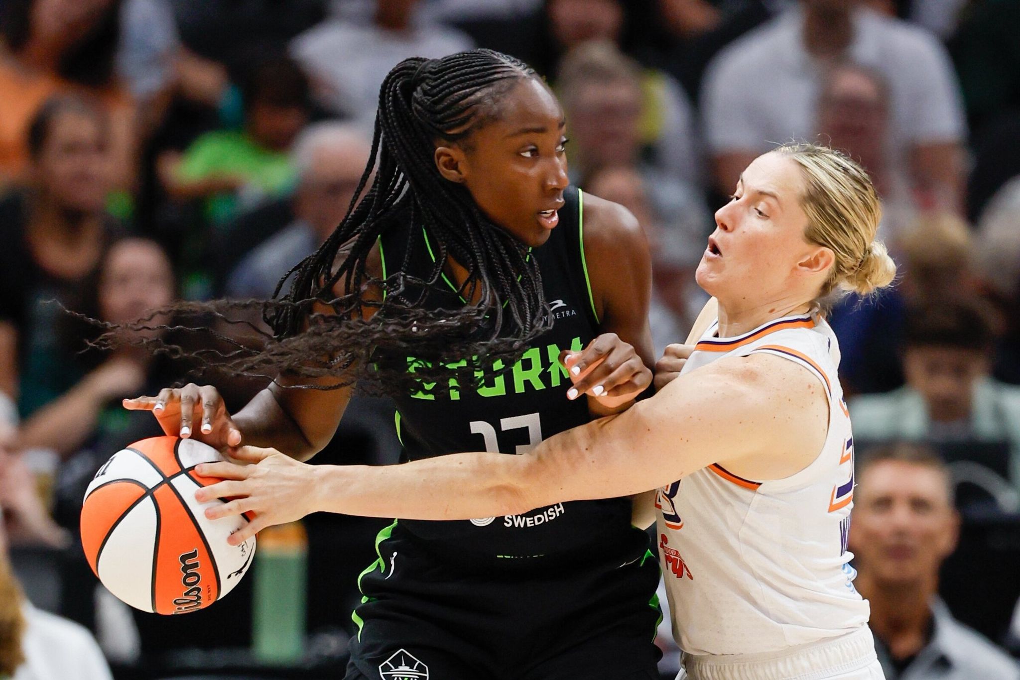Phoenix Mercury guard Sami Whitcomb strips the ball from Seattle Storm forward Ezi Magbegor in the third quarter Sunday, Aug. 17, 2025, in Seattle. (Jennifer Buchanan / The Seattle Times)