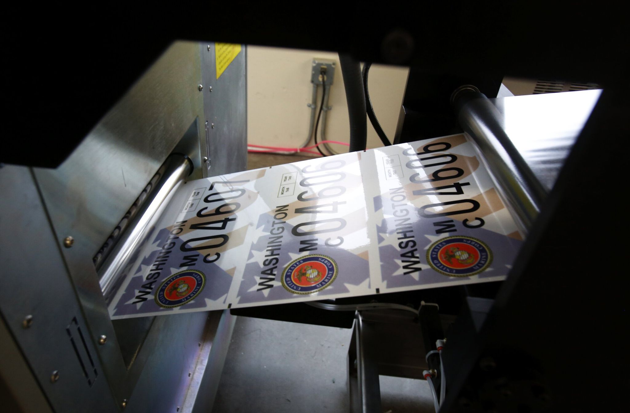 Washington issues a variety of specialty license plates, including plates representing organizations, the armed forces and veterans, colleges and universities, as well as parks and environmental conservation. (Alan Berner / The Seattle Times, 2014)