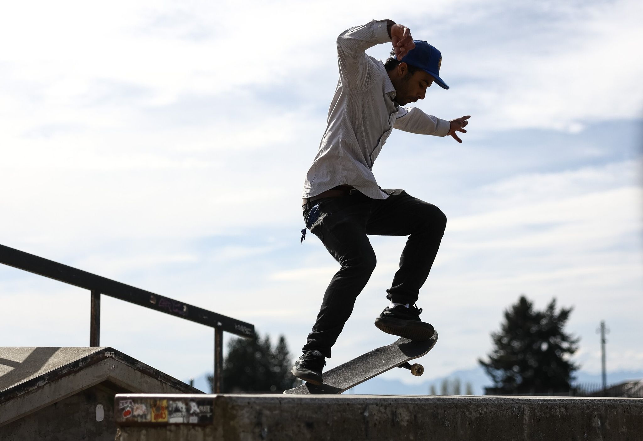 Aquila David glides along a curb on a skateboard at Jefferson Park on Sunday in Seattle. (Nick Wagner / The Seattle Times)