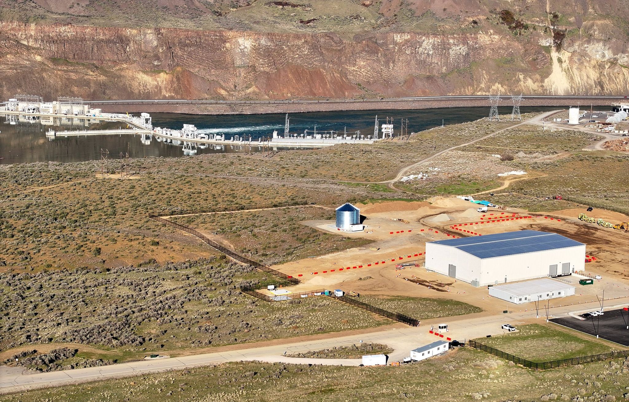 Pictured is an assembly building and office for Helion’s fusion power plant that will sit near the Columbia River and Rock Island hydroelectric dam in Malaga, Chelan County. (Karen Ducey / The Seattle Times)