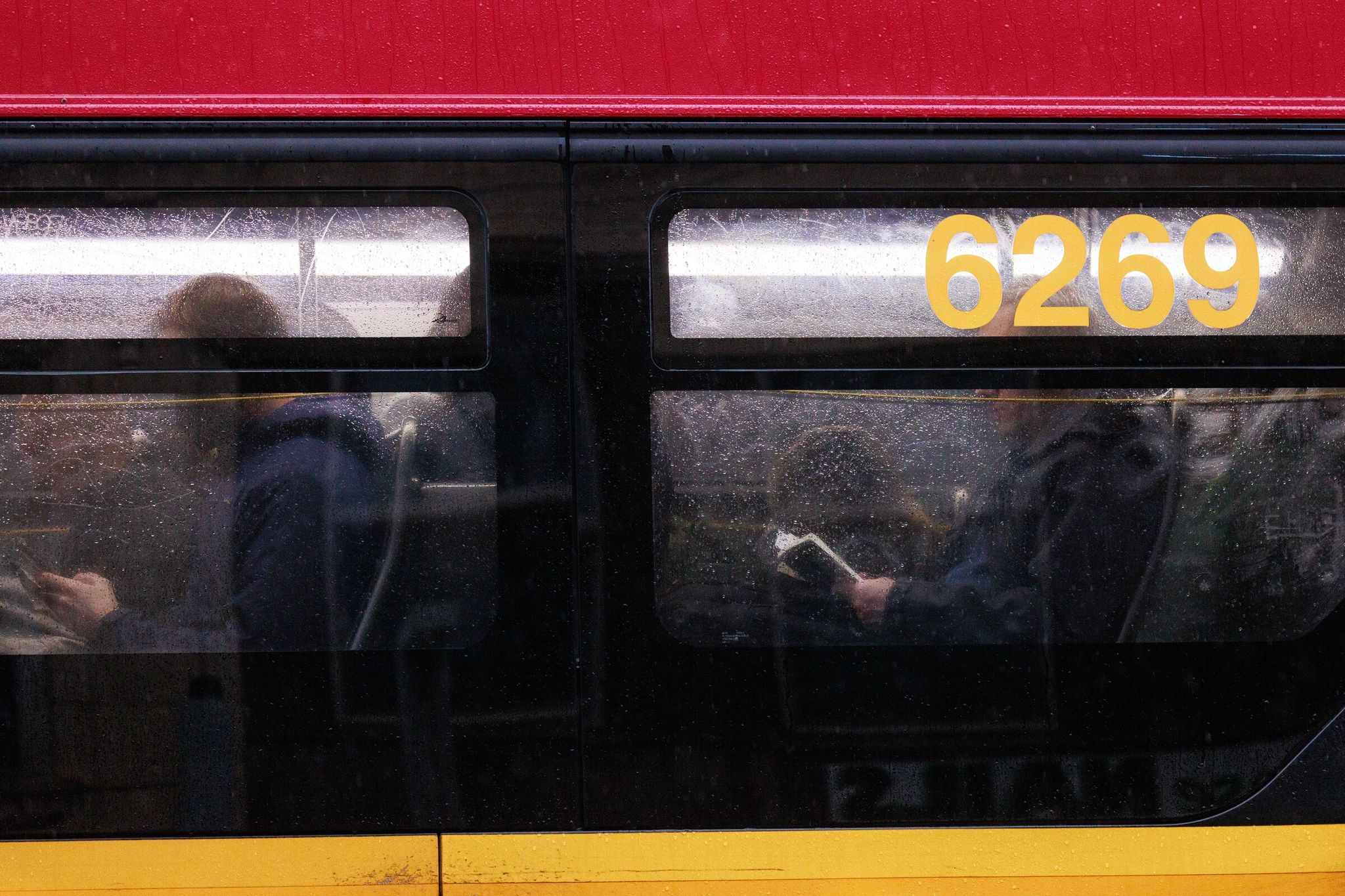 Passengers on a bus in West Seattle Dec. 8, 2025. (Erika Schultz / The Seattle Times)