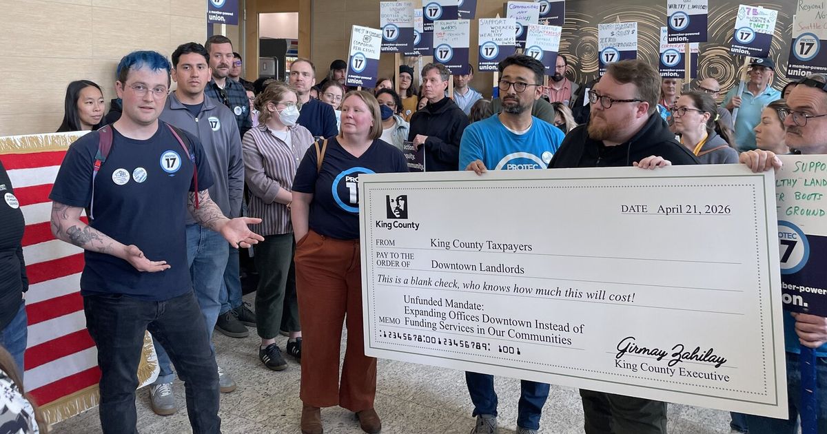 About 75 King County workers occupied the lobby of the county’s primary downtown Seattle office building on Tuesday to protest King County Executive Girmay Zahilay’s mandate that they return to the office at least three days a week.