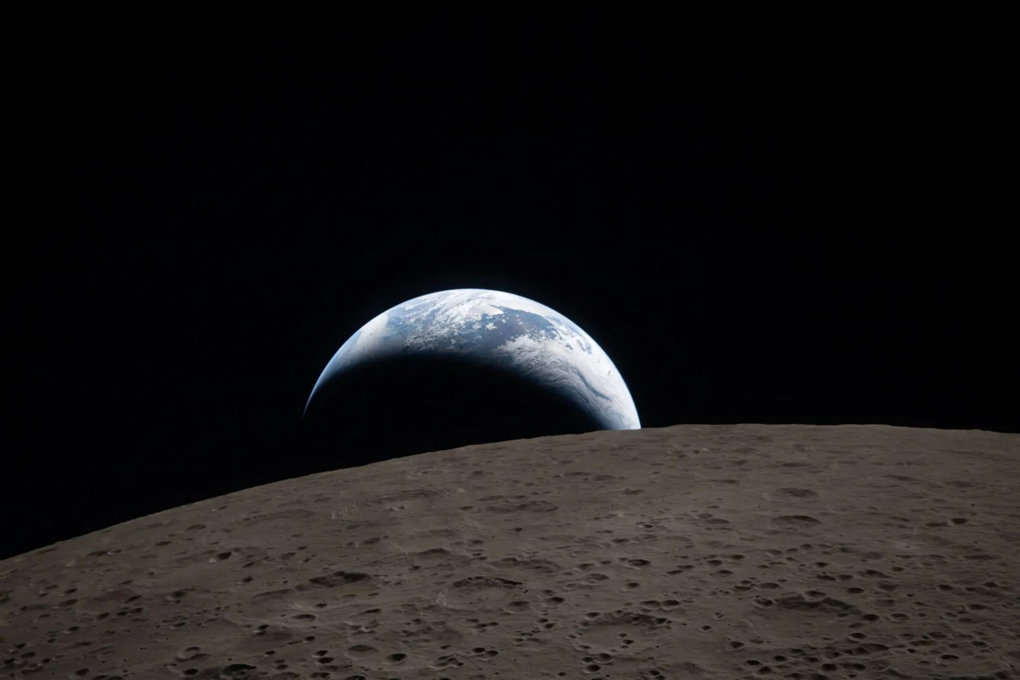 Earthset photographed through the Orion spacecraft window at 6:41 p.m. on April 6, 2026, during Artemis II’s lunar flyby. (NASA / TNS)