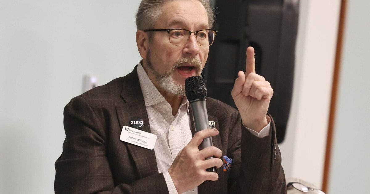 Pressure is building on King County Assessor John Wilson to resign, as he faces criminal charges related to allegations that he stalked his ex-fiancée.