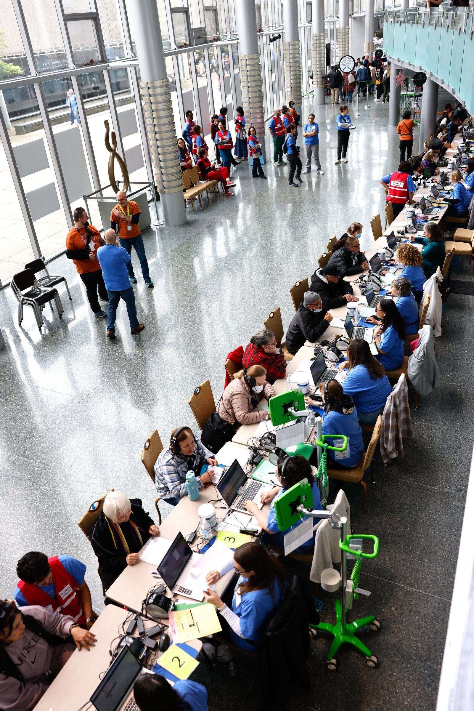 Check‑in stations lined up in McCaw Hall during the Seattle/King County clinic offering free dental, vision and medical services to people facing barriers to health care or who cannot afford it, on Thursday, April 23, 2026. (Karen Ducey / The Seattle Times)