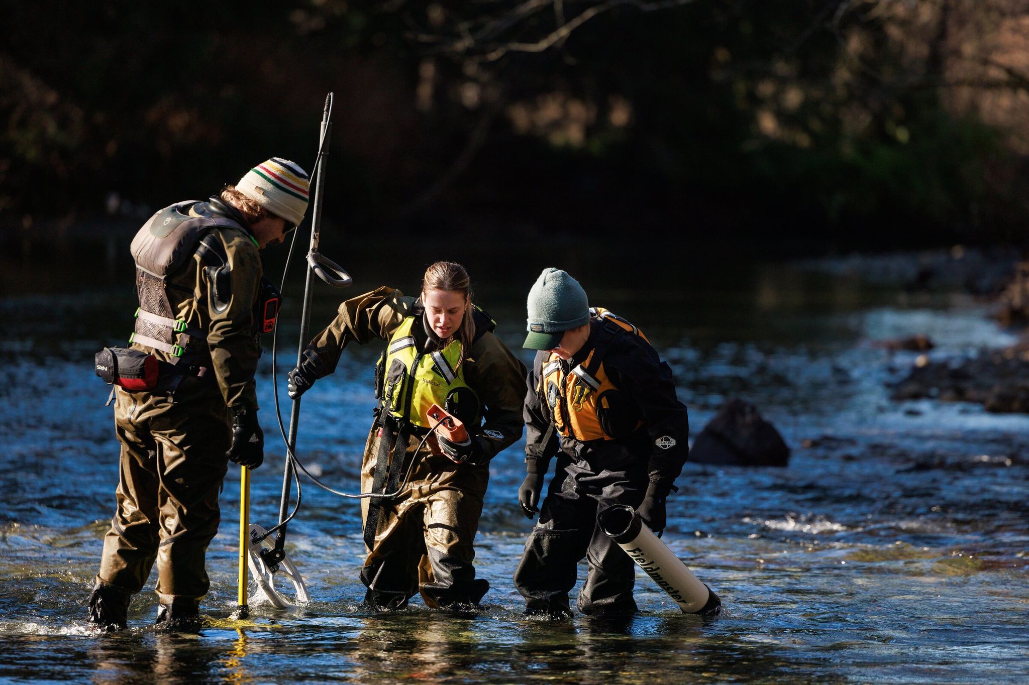 Cooper Oswald, spawning-habitat survey specialist, Michaela Low, research scientist with the Washington Department of Fish and Wildlife, and Bethany Craig, research scientist, work in Squire Creek, a tributary of the North Fork Stillaguamish River, Jan. 21. Low and the team of scientists are studying how sediment deposition and scour may affect Chinook egg survival. (Erika Schultz / The Seattle Times)