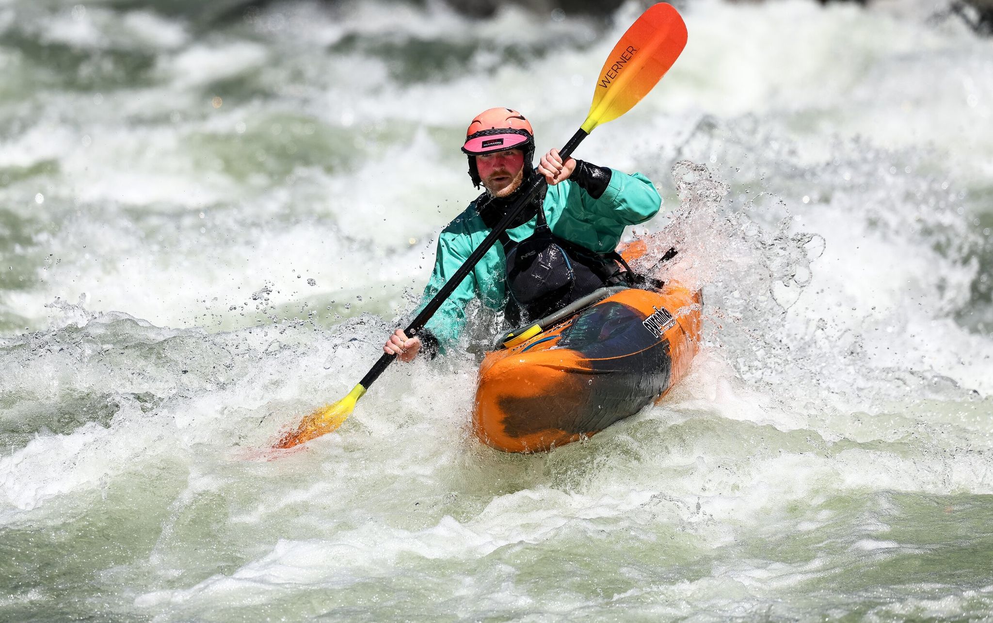 Zach Allin kayaks through whitewater rapids in the Wenatchee River on Saturday near Leavenworth. Nice weather will likely draw people into the outdoors this week. (Nick Wagner / The Seattle Times)