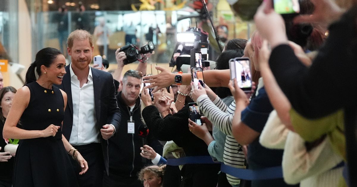 Prince Harry and Meghan arrive in Australia for a low-key, privately funded visit