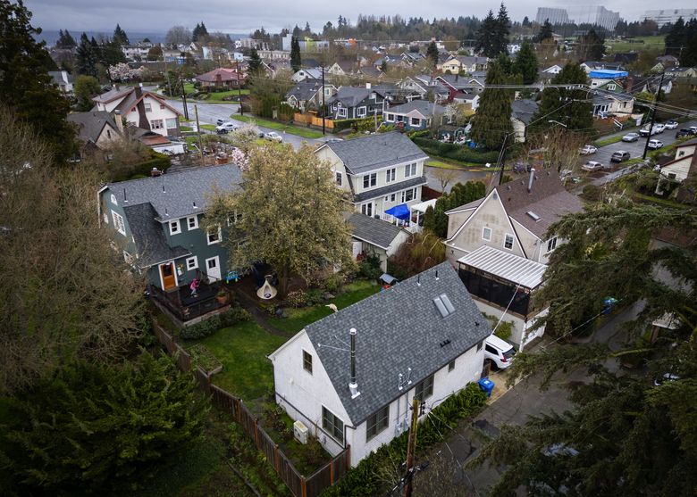 The DADU, in the foreground, is behind the house of married couple Logan Cox and Sara Knowles, in Seattle’s Beacon Hill neighborhood. (Ken Lambert / The Seattle Times)