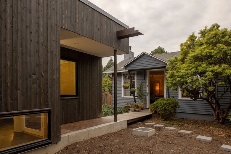 A path leads from the DADU’s entryway, across a bridge toward the existing bungalow. (Rafael Soldi / Courtesy of Robert Hutchison Architecture)
