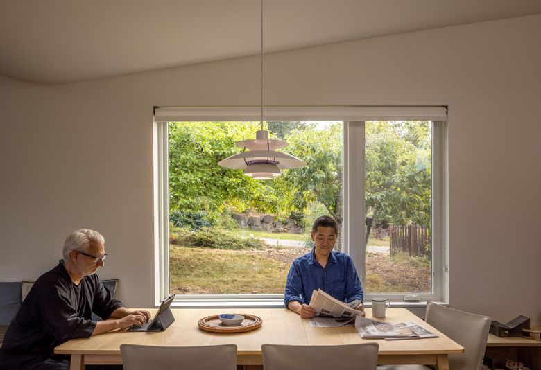 Oshima, right, sits next to Hutchison in the dining area. (Rafael Soldi / Courtesy of Robert Hutchison Architecture)