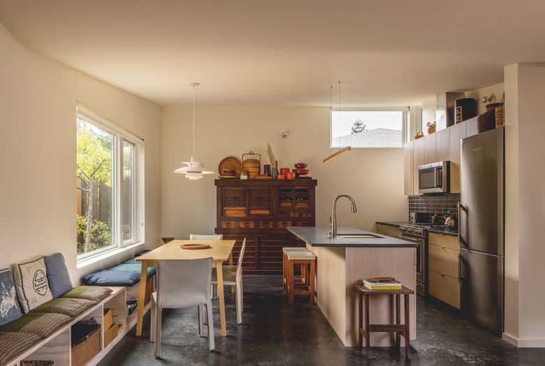 An open kitchen connects to the dining area, which doubles as workspace for Oshima. (Rafael Soldi / Courtesy of Robert Hutchison Architecture)