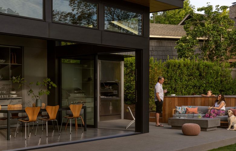 Created for gatherings with friends and family, the 914-square-foot space backyard pavilion at the home of Cecilia Flombaum and Per Mikkelsen has a dining area at one end that opens completely to a barbecue. (Rafael Soldi / Courtesy of DeForest Architects)