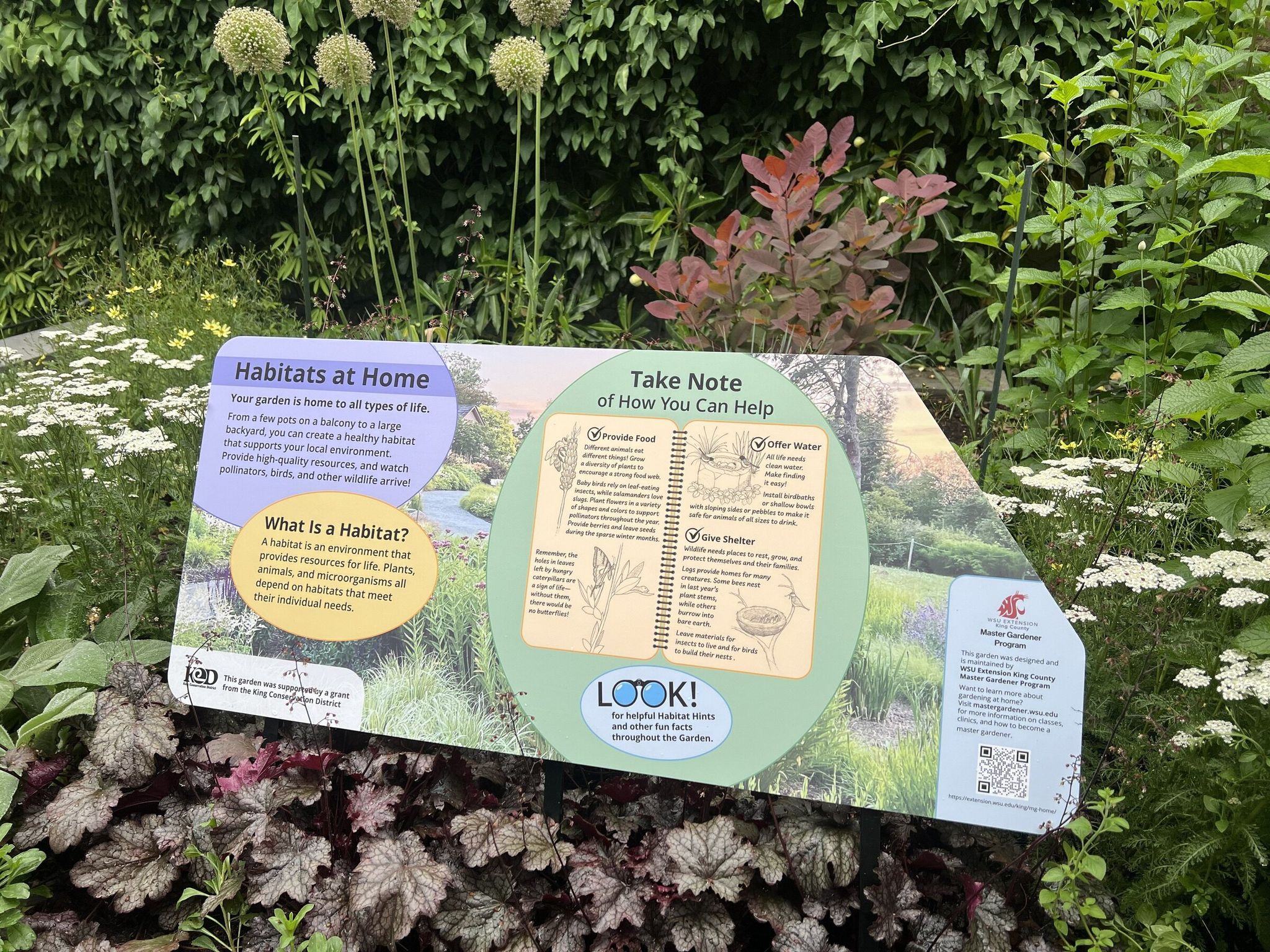 An interpretive sign in the Habitats at Home garden explains what goes into creating wildlife‑friendly landscaping. (James Gagliardi)