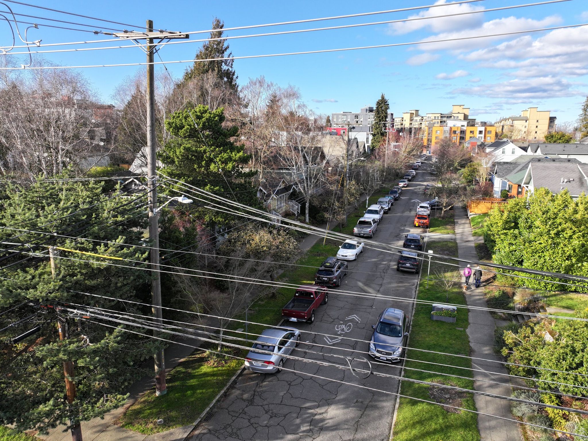 Power lines stand at 22nd Avenue and East Pine Street in Seattle. Last month, companies approached Seattle City Light recently about building five large data centers that, combined, would need roughly one-third of the electricity Seattle uses on an average day. (Karen Ducey / The Seattle Times)