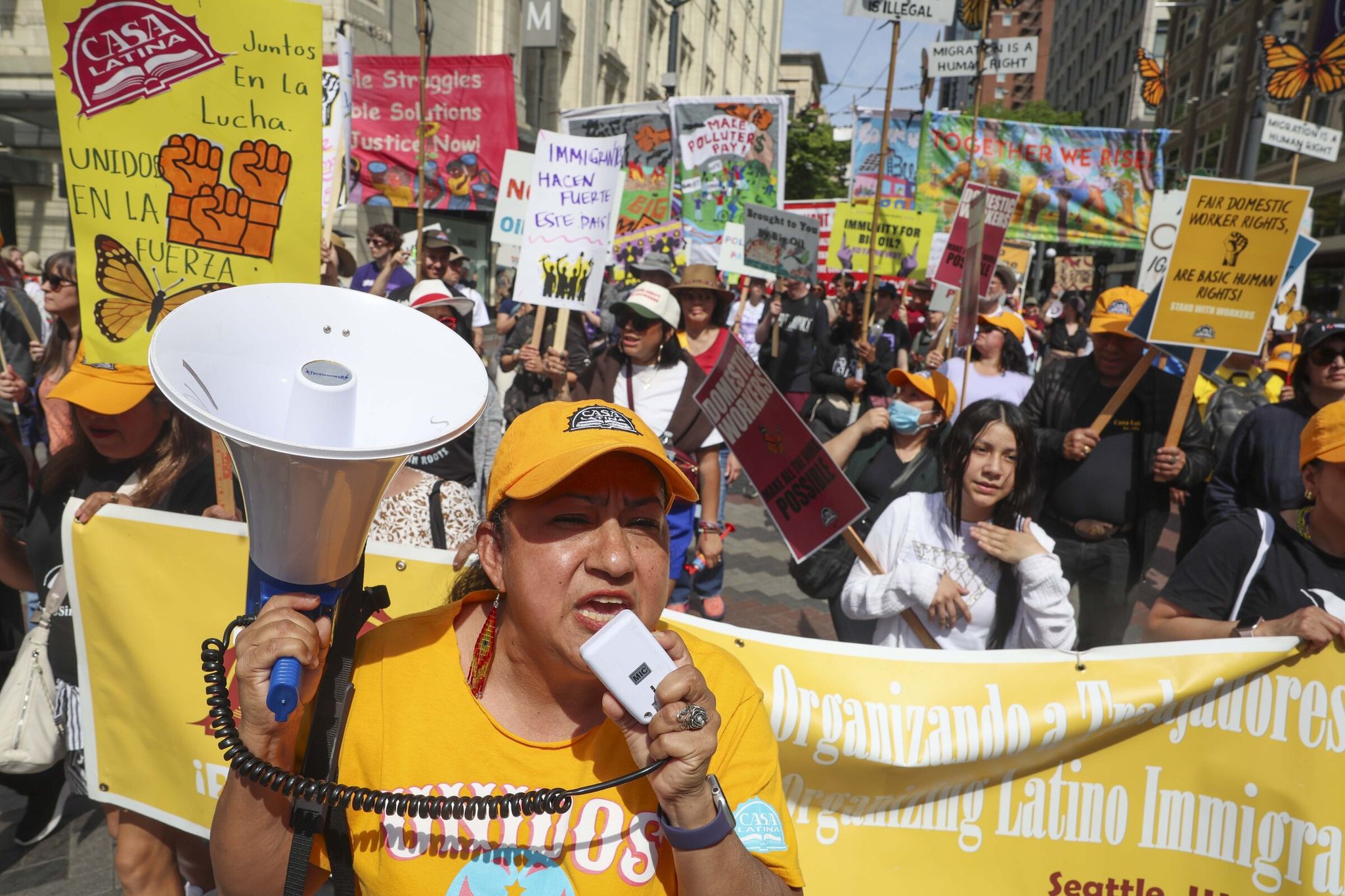 Silvia Gonzalez, a community organizer with Casa Latina, chants during a May Day march to demonstrate solidarity with workers, migrants and immigrants in Seattle on Friday. The event celebrates International Workers’ Day. (Ivy Ceballo / The Seattle Times)
