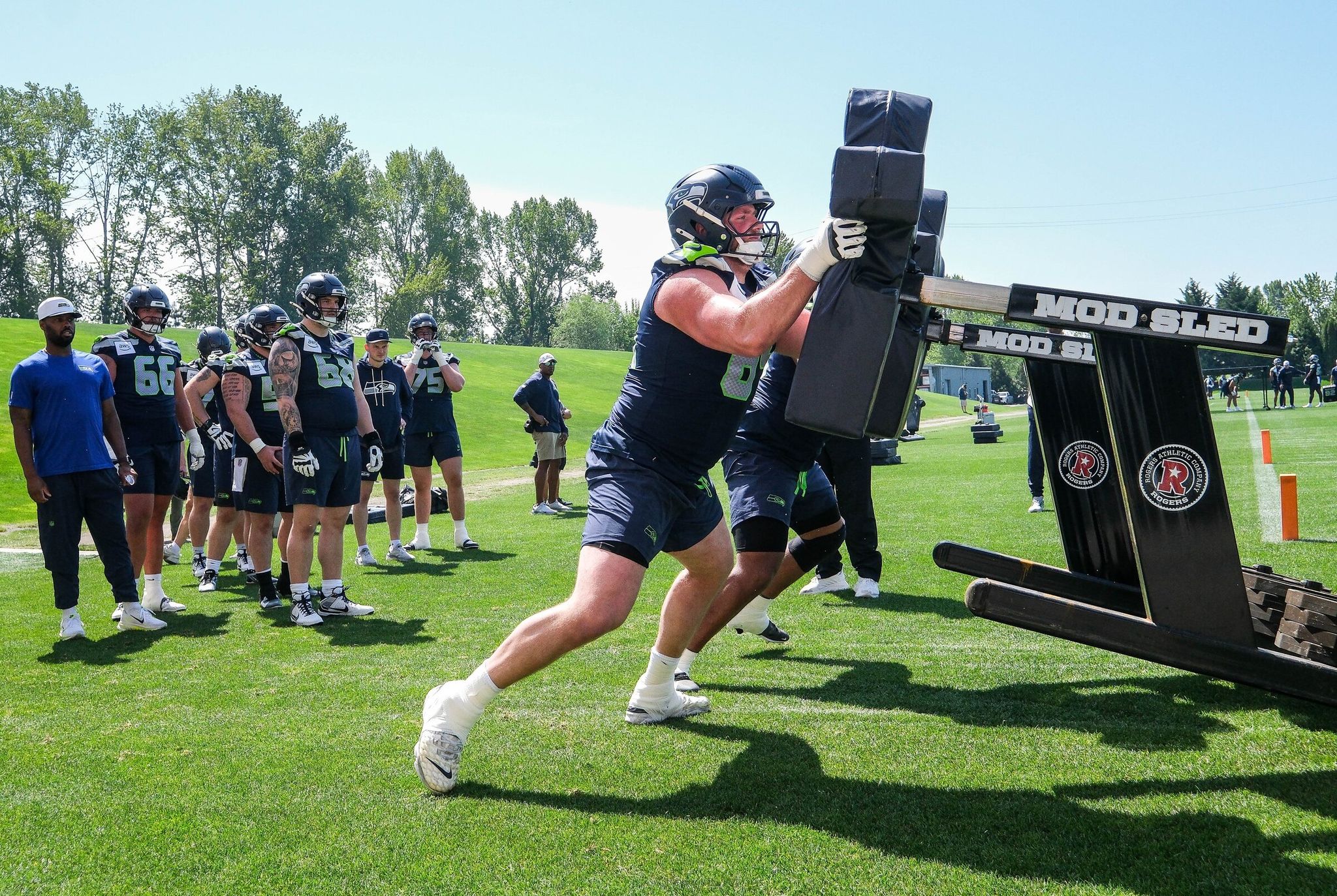 Offensive guard Tyler Doty (64) and fellow rookies work out with the Seahawks at Virginia Mason Athletic Center in Renton on Saturday. (Dean Rutz / The Seattle Times)
