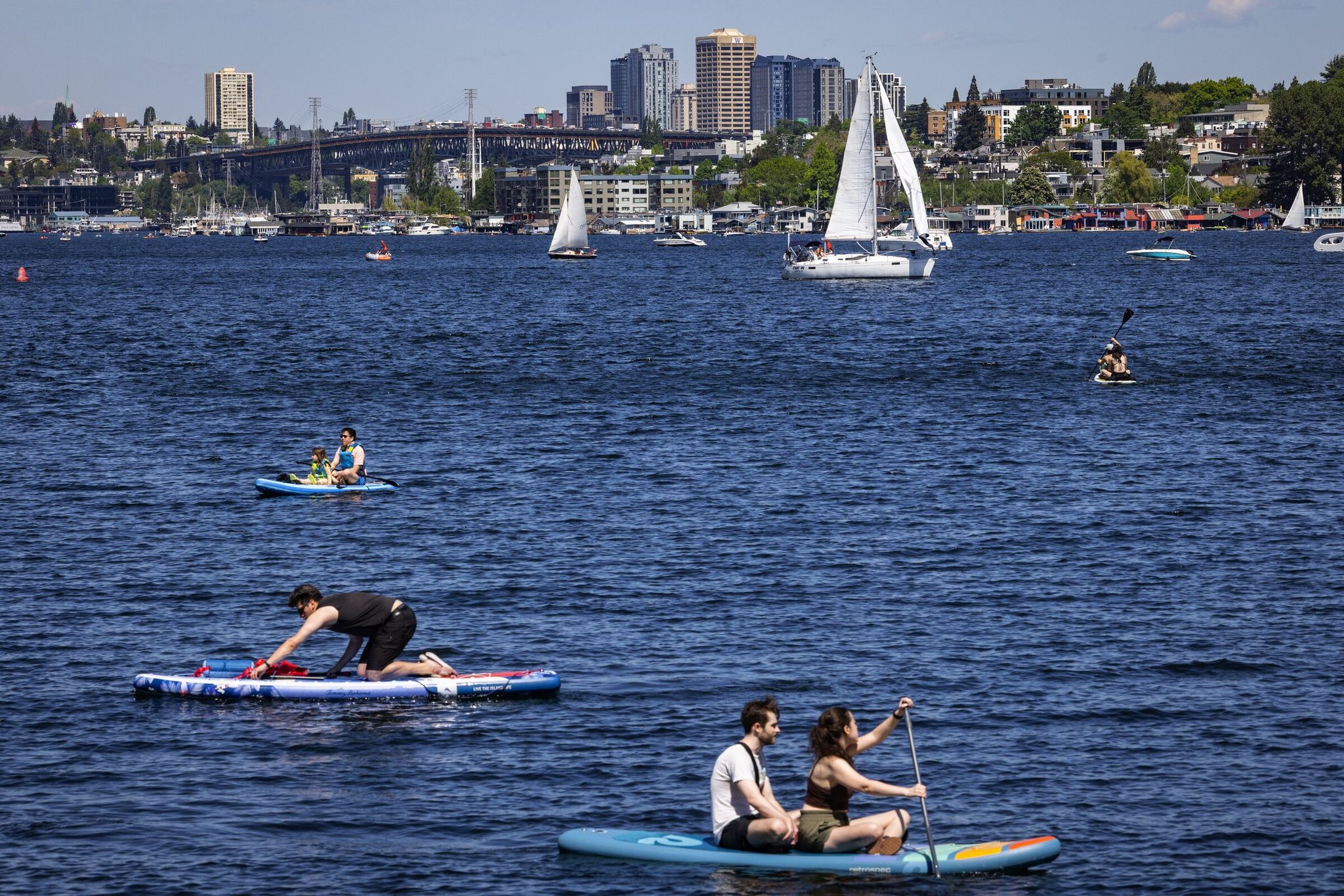 People are out on the waters of Lake Union as summerlike temperatures head into the high 70s, Sunday afternoon in Seattle. (Ken Lambert / The Seattle Times)