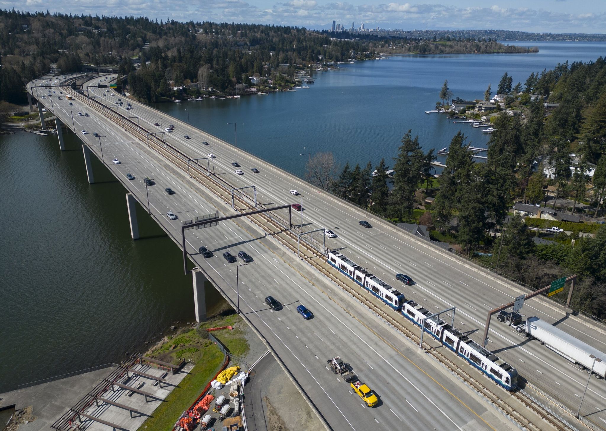 A light rail train heads west from Bellevue to Mercer Island, top left, and Seattle, top center, during a practice run before the March 28 opening. (Ellen M. Banner / The Seattle Times)