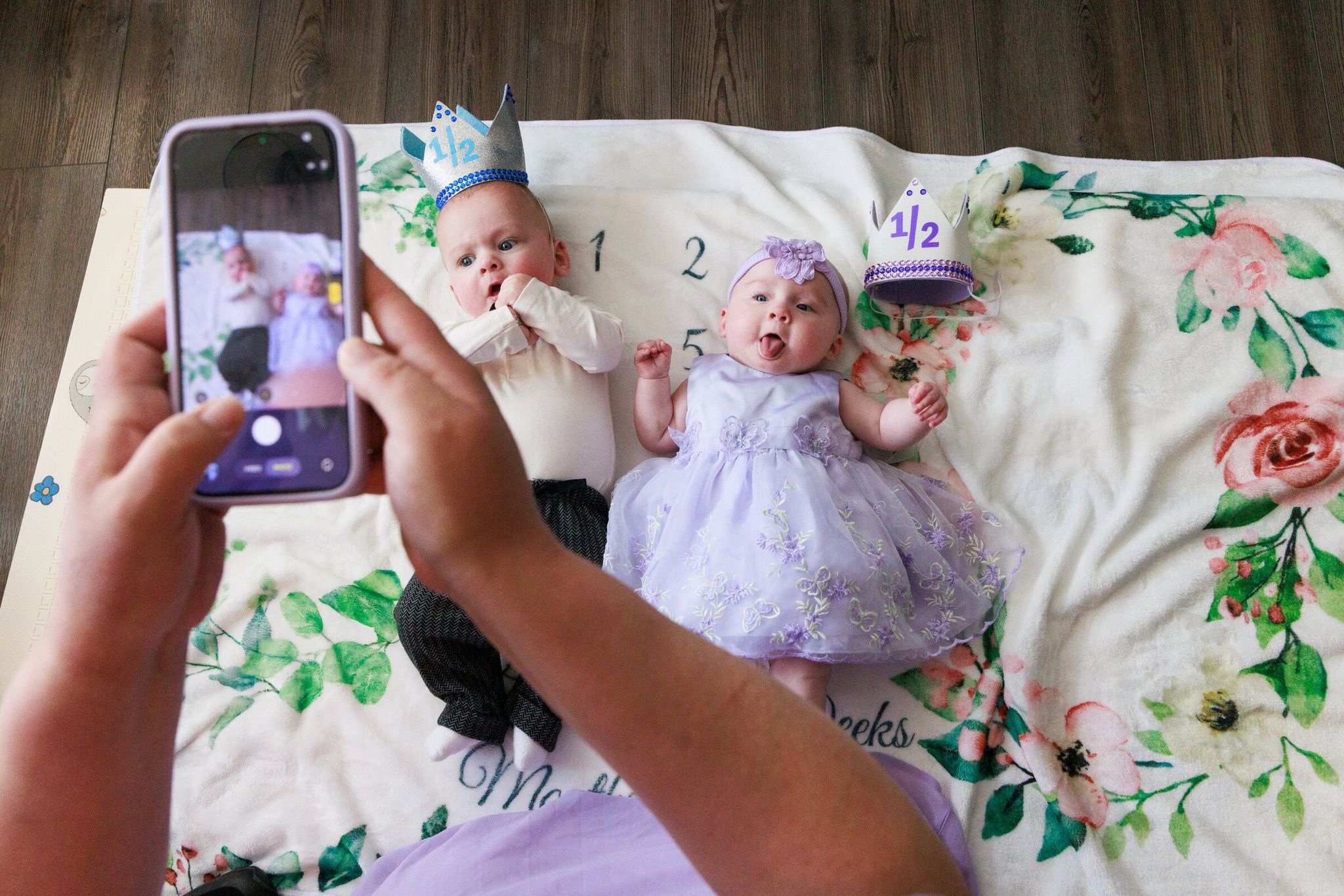 Jessica Adams photographs twins Jackson and Maxine at home in Pacific on their half‑birthday, April 30. Earlier that day Maxine was discharged from Seattle Children’s. Nurses from various hospital units visited them during routine photo shoots. It was the babies’ first photo session at home. (Erika Schultz / The Seattle Times)