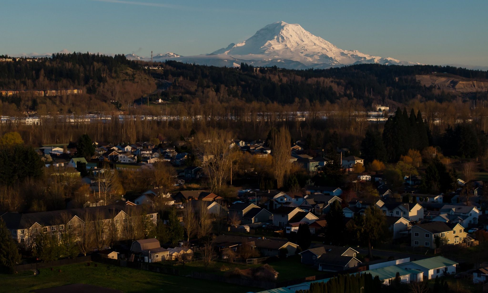 Mount Rainier rises above Pacific, located between Seattle and Tacoma. Residents say affordable housing, proximity to work and a quiet lifestyle for raising a family attracted them to this small city. (Erika Schultz / The Seattle Times)