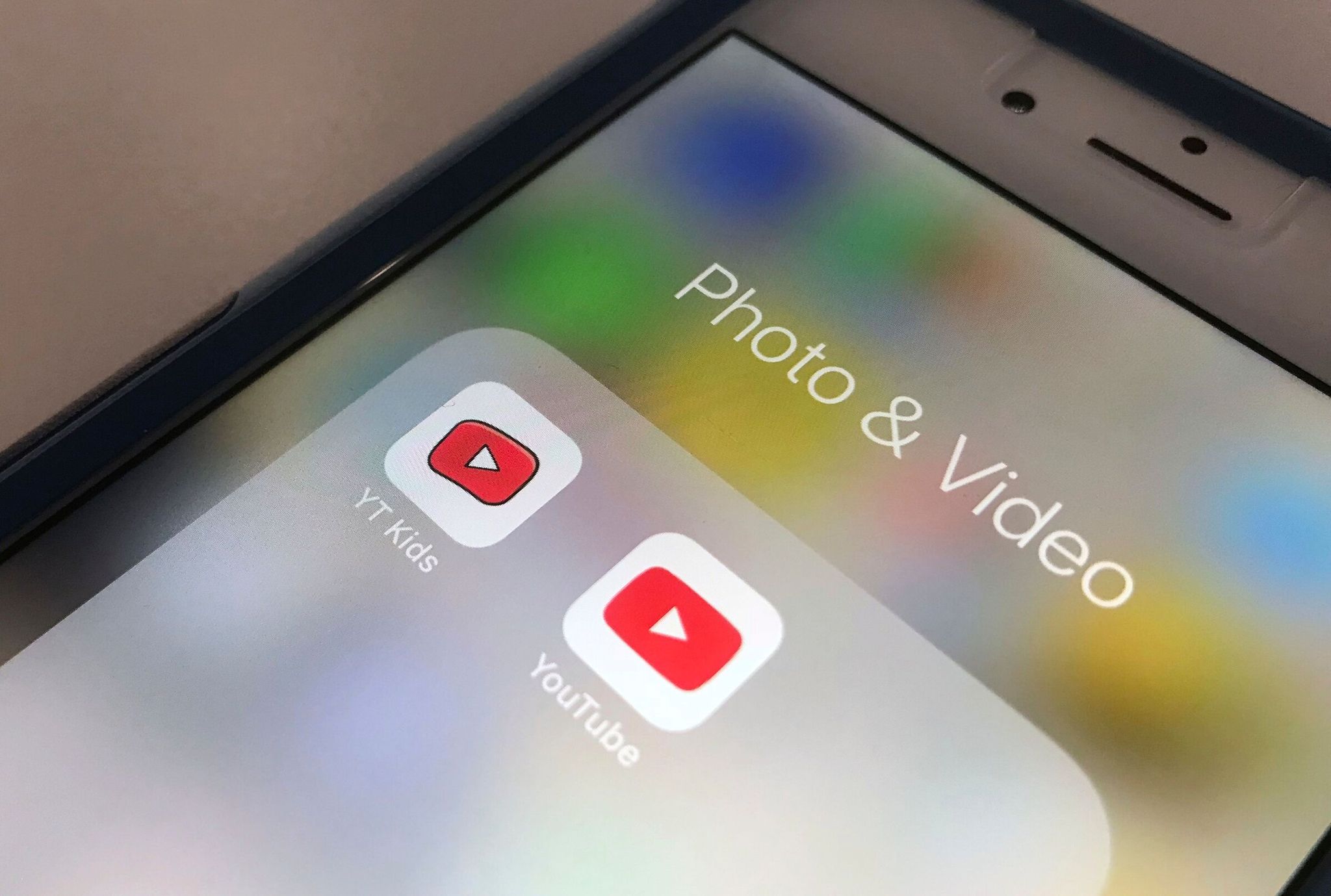 The YouTube app and YouTube Kids app are displayed on a smartphone. According to a New York Times report, up to 40% of videos recommended to children on YouTube now appear to be AI-generated.  (Jenny Kane / The Associated Press)