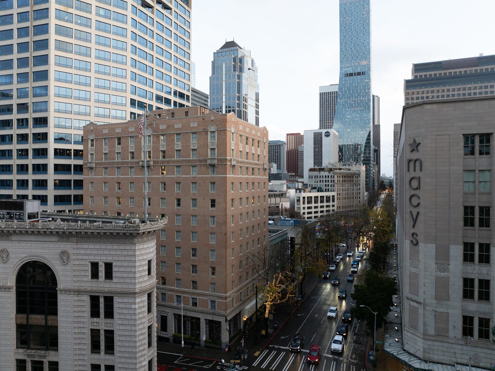 The Mayflower Park Hotel, left center, located in downtown Seattle, seen looking up Fourth Avenue in December 2024. (Karen Ducey / The Seattle Times)