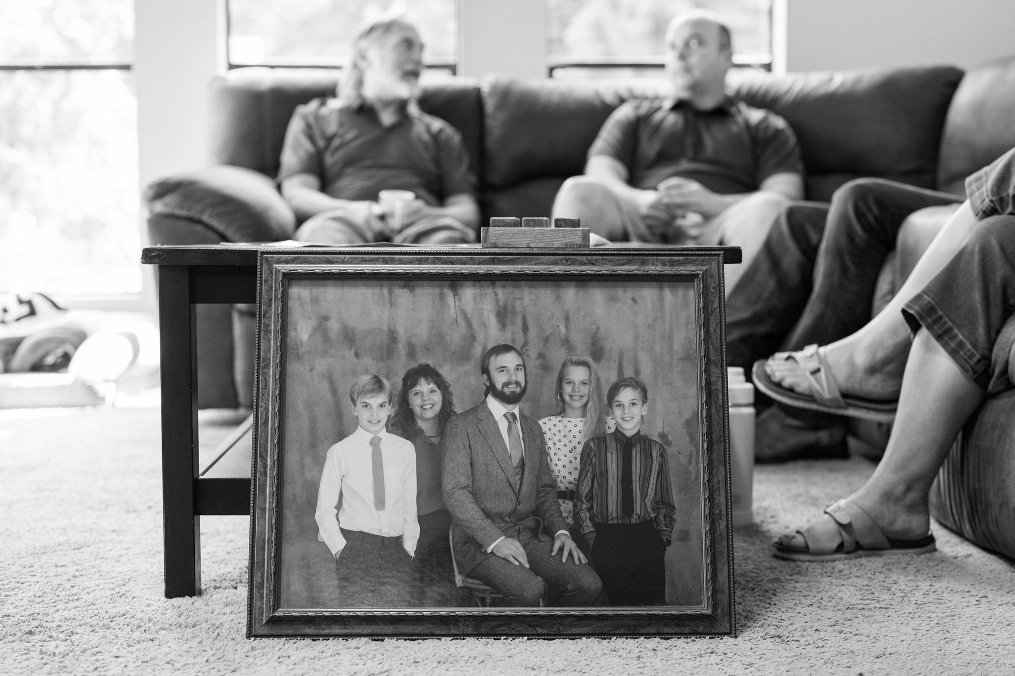 A family photo of the Lawsons lies on the floor in Heidi Hendrickson’s home. (Chona Kasinger/The New York Times)