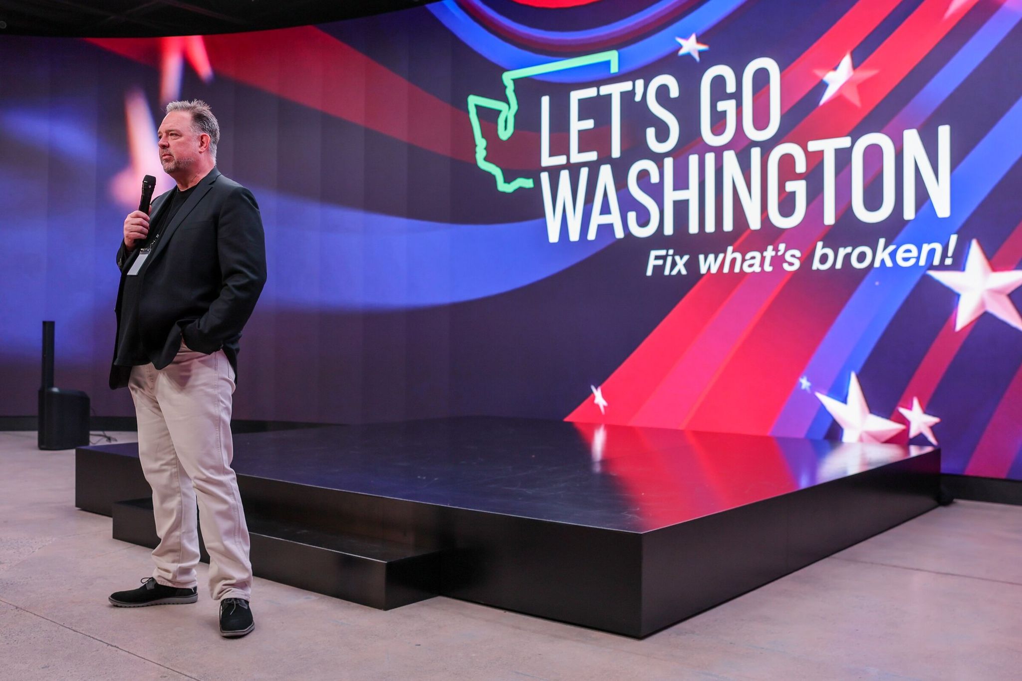 Brian Heywood addresses supporters of ballot initiatives during the Let’s Go Washington watch party in Kirkland on Nov. 5, 2024. (Kevin Clark / The Seattle Times)