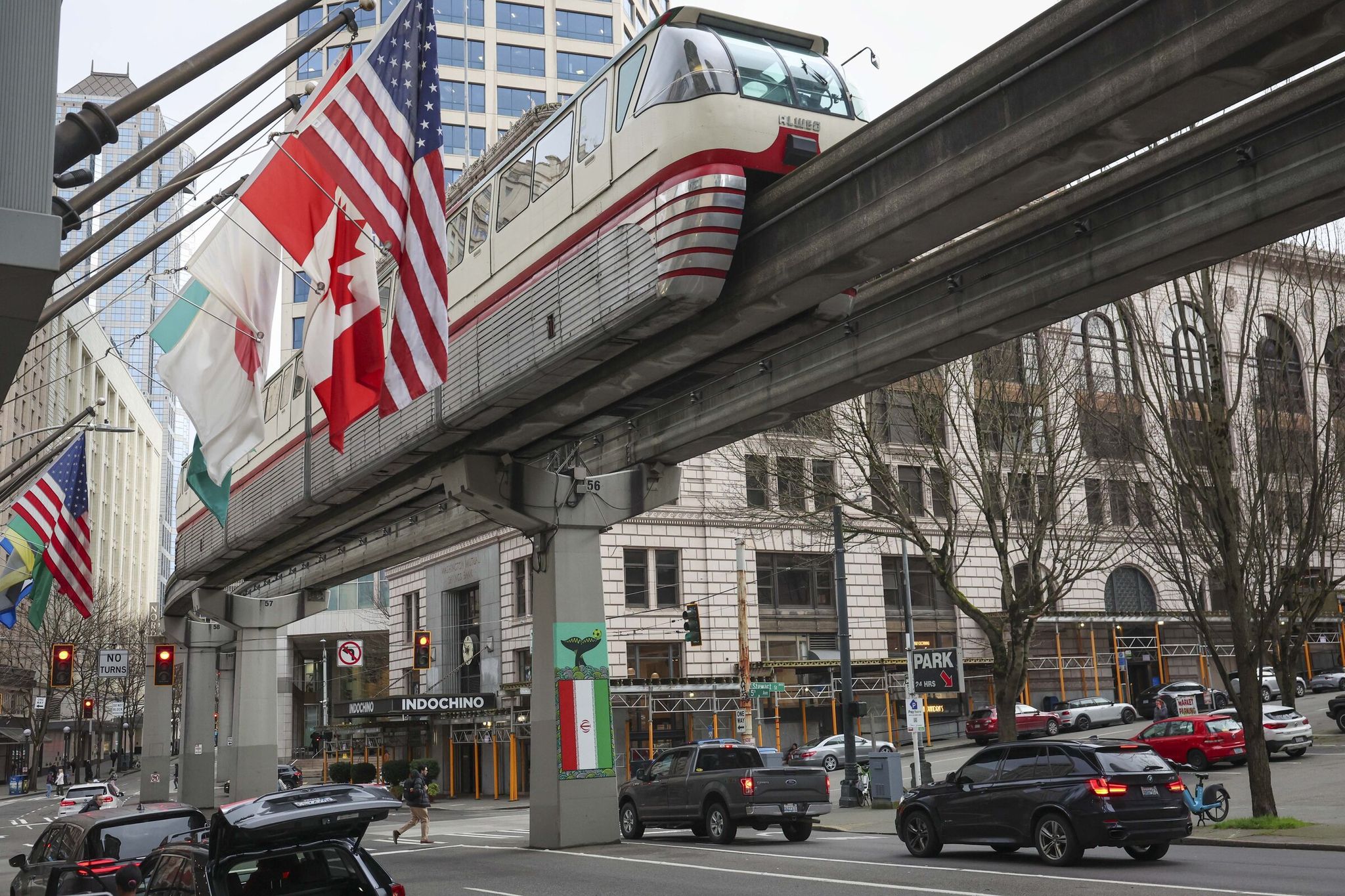 The Iranian flag among flags that were part of of an installation along the Seattle Monorail marking 100 days until the FIFA World Cup 2026, at Westlake Tower in Seattle on March 3.  (Ivy Ceballo / The Seattle Times)