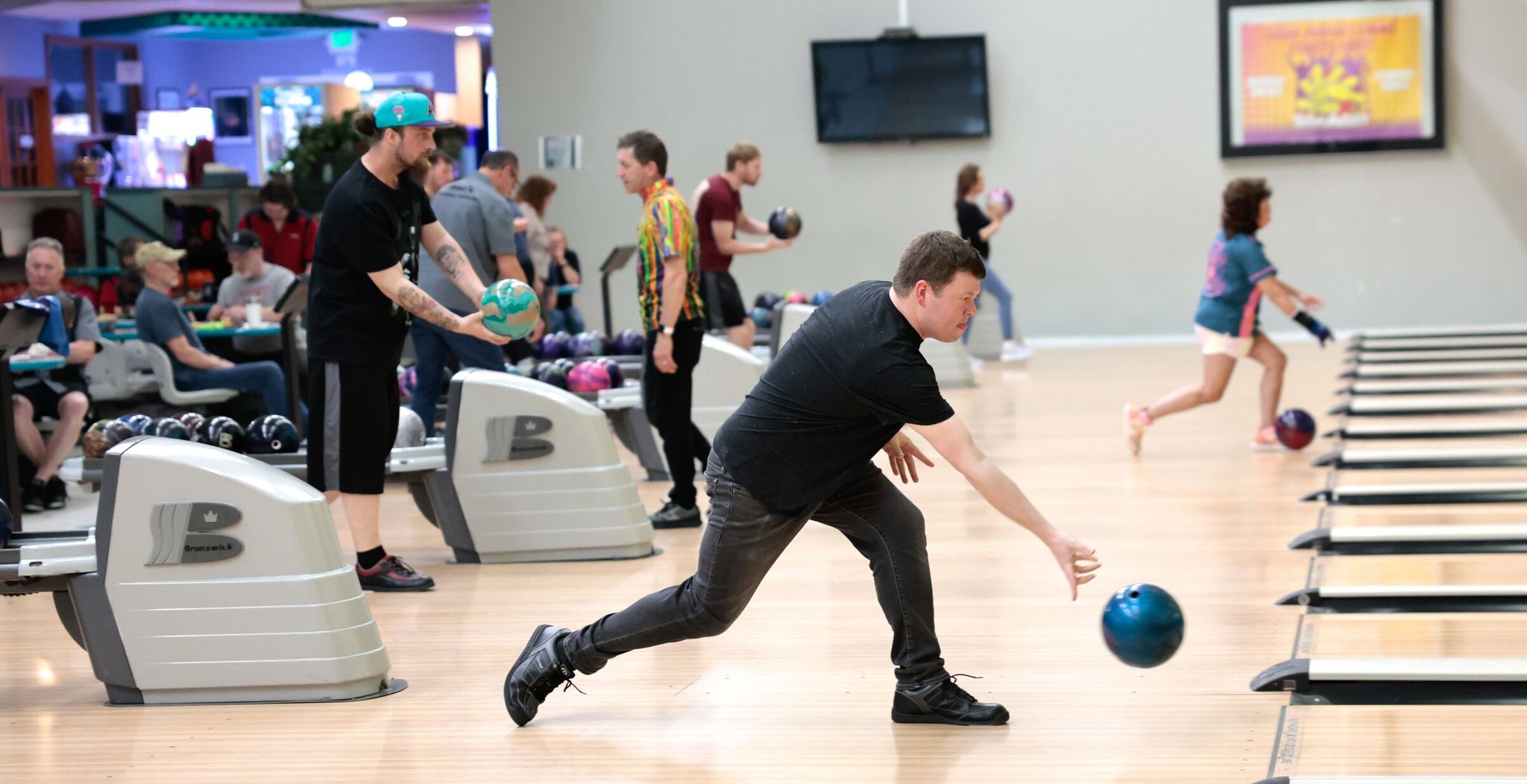 Spin Alley bowling in Shoreline is packed this month with participants in the Thursday Knight league. (Karen Ducey / The Seattle Times)