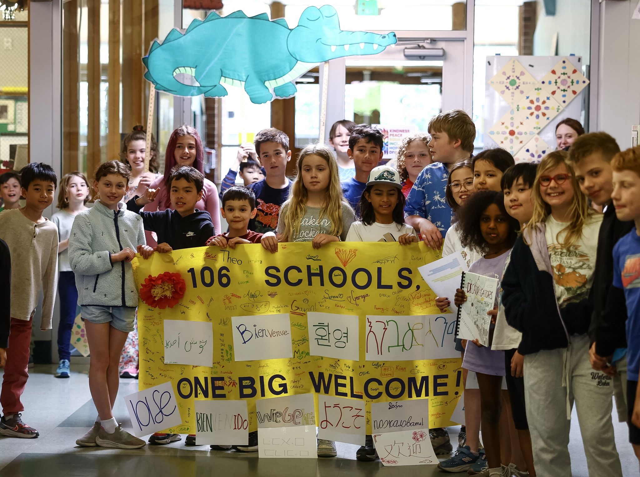 Decatur Elementary students greet Seattle Public Schools Superintendent Ben Shul­diner with a song and a handmade sign marking his visit to each of the district’s 106 schools on Monday. (Nick Wagner / The Seattle Times)
