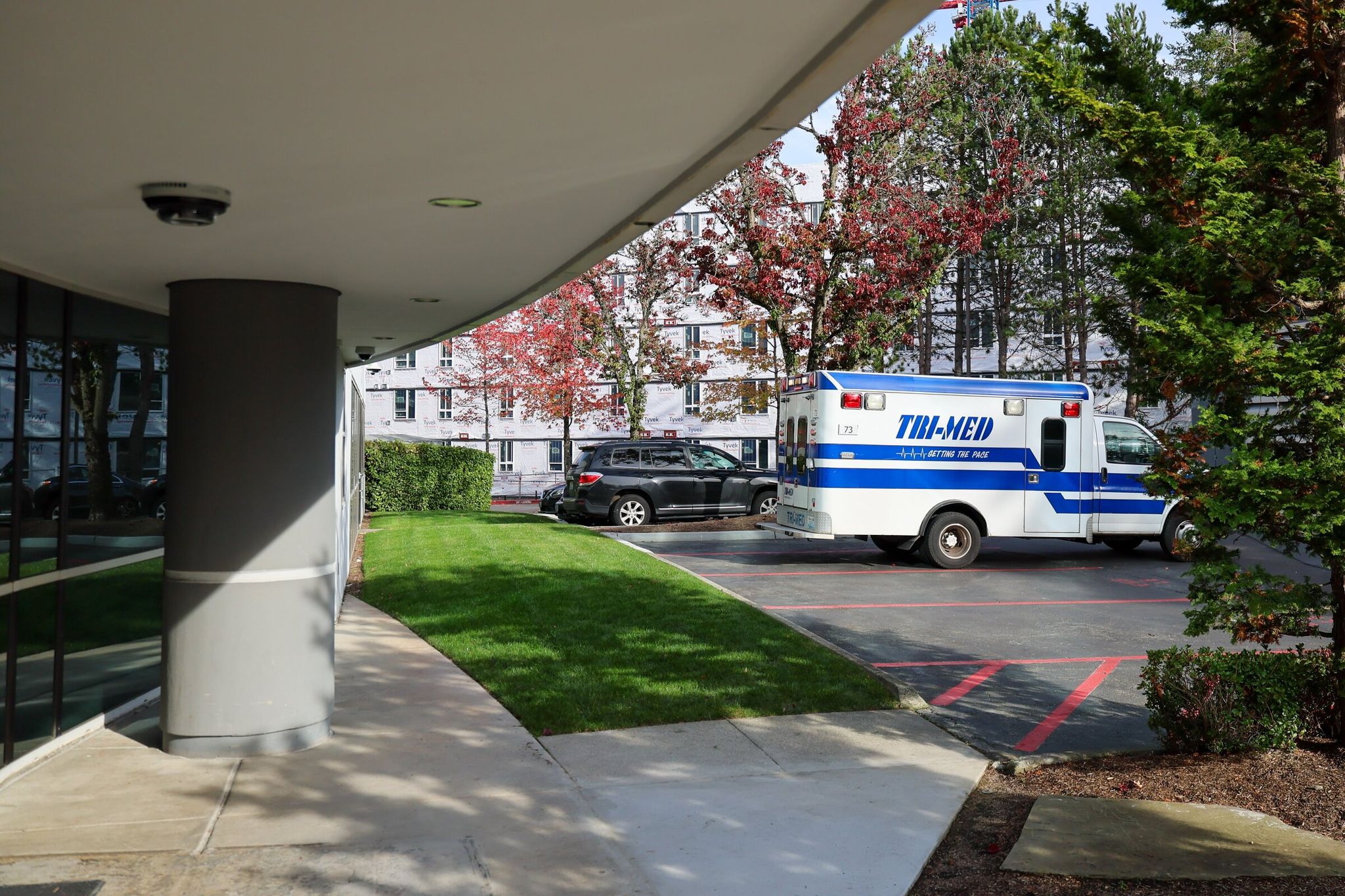 An ambulance arrives transporting a patient Friday afternoon at Connections Kirkland, a 24-hour walk-in crisis care center in Kirkland, pictured in 2024. (Kevin Clark / The Seattle Times)