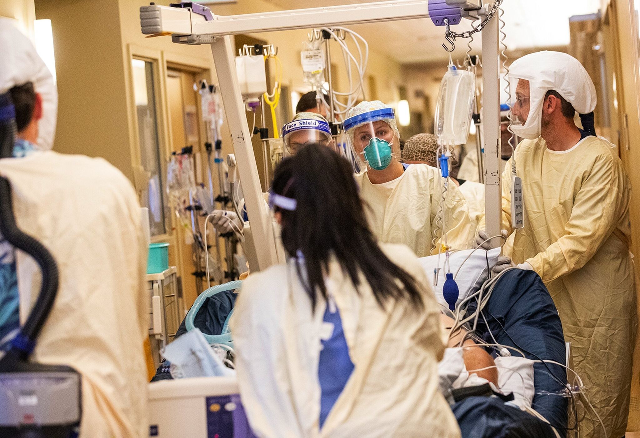 A medical team moves a COVID-19 patient to a new room in the ICU at Central Washington Hospital in 2021. FEMA will reimburse some of the state’s COVID-related healthcare costs, such as for protective equipment and added staffing. (Amanda Snyder / The Seattle Times)